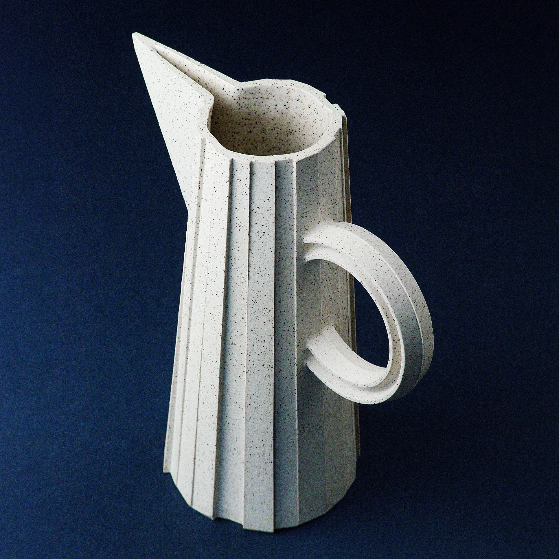 Handmade faceted ceramic pitcher in speckled white stoneware, by Lea & Nicolas