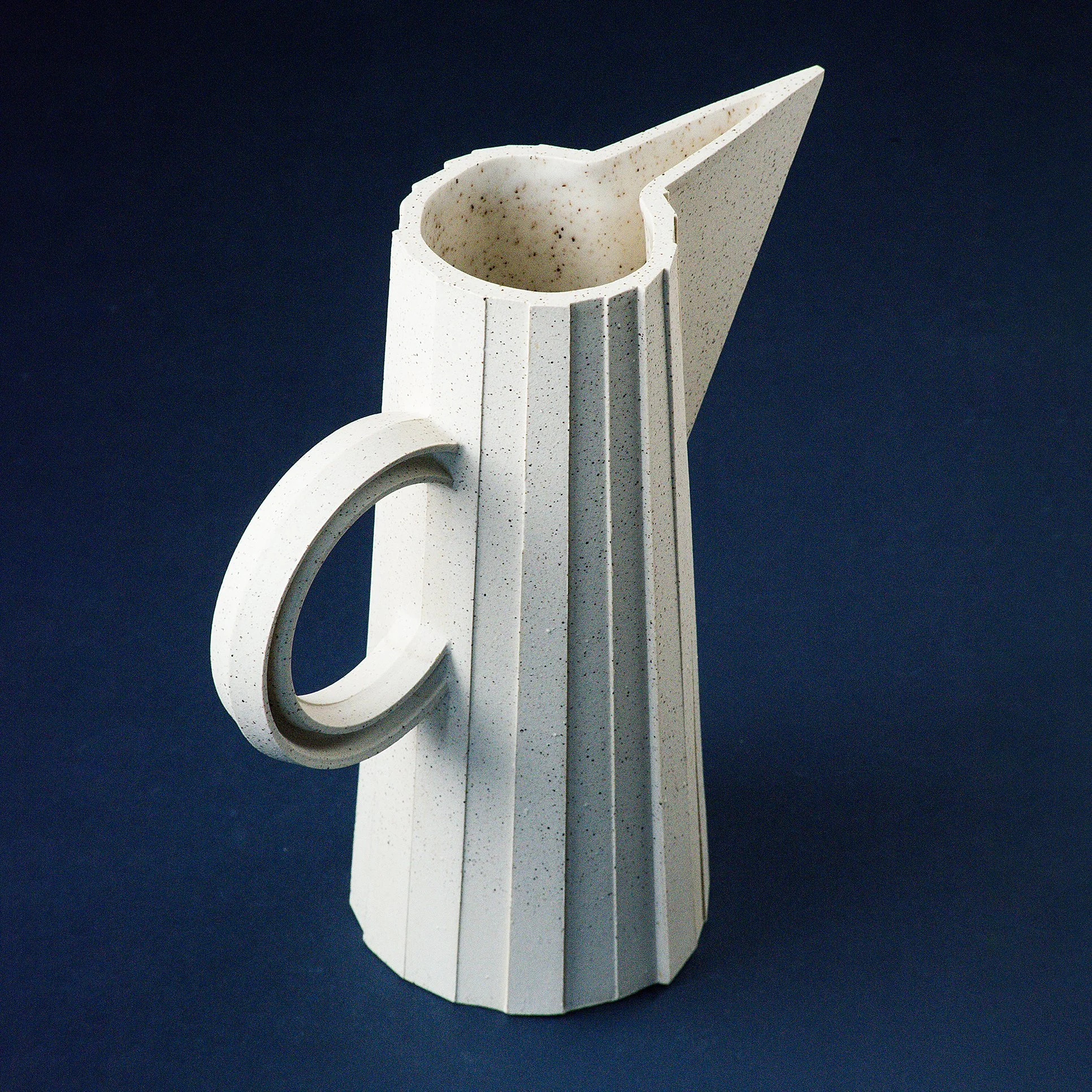 Handmade faceted ceramic pitcher in speckled white stoneware, by Lea & Nicolas