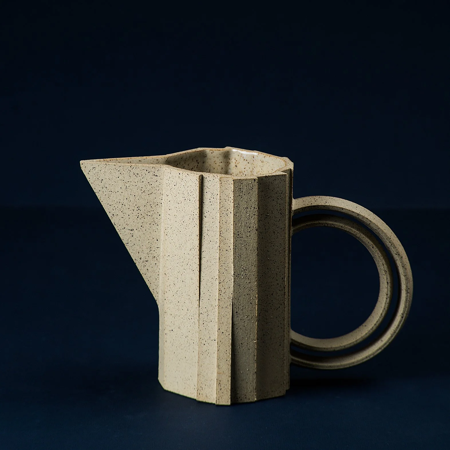 Handmade brutalist faceted ceramic pitcher in speckled stoneware, by Lea & Nicolas