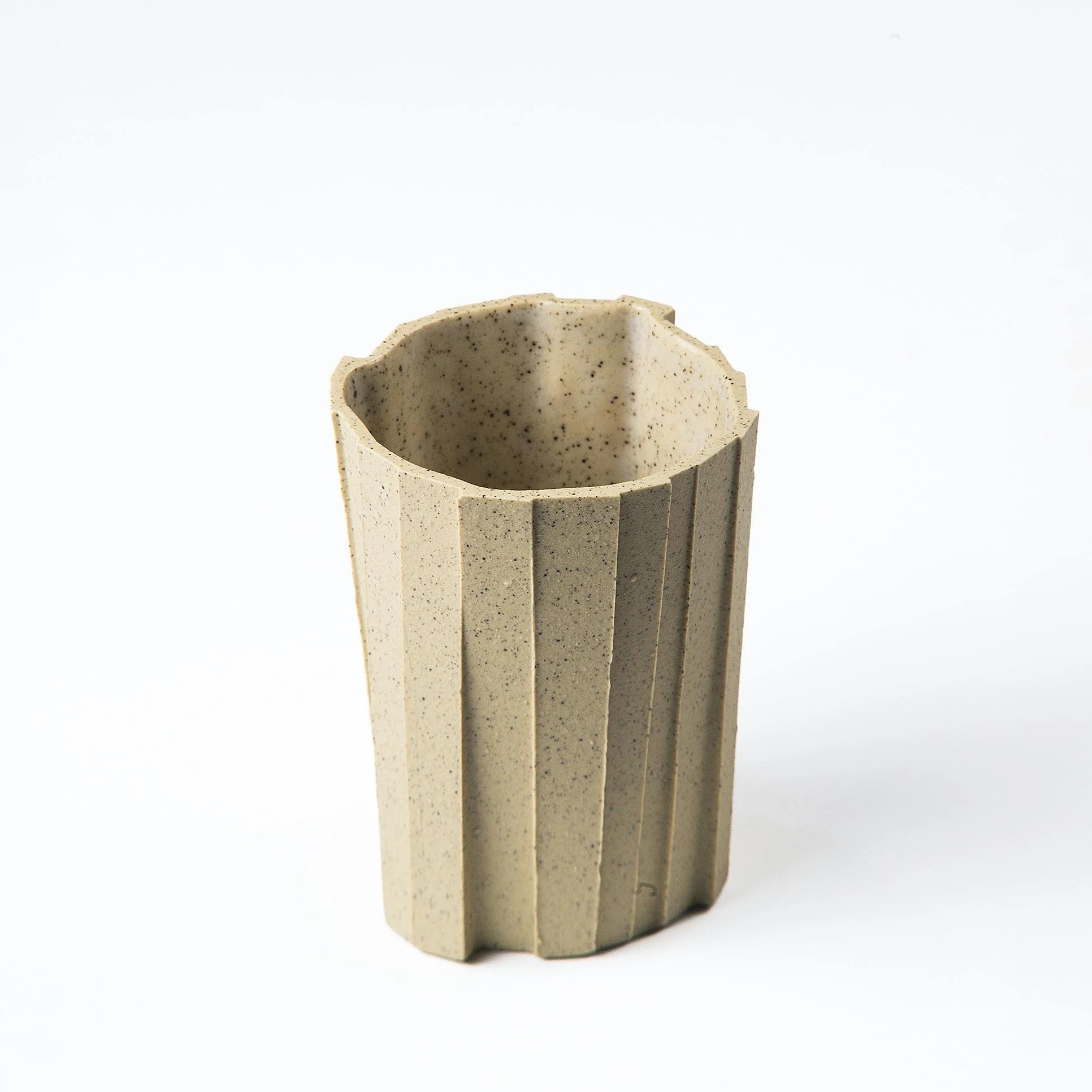 Brutalist handmade faceted ceramic tumbler in speckled buff stoneware, by Lea & Nicolas