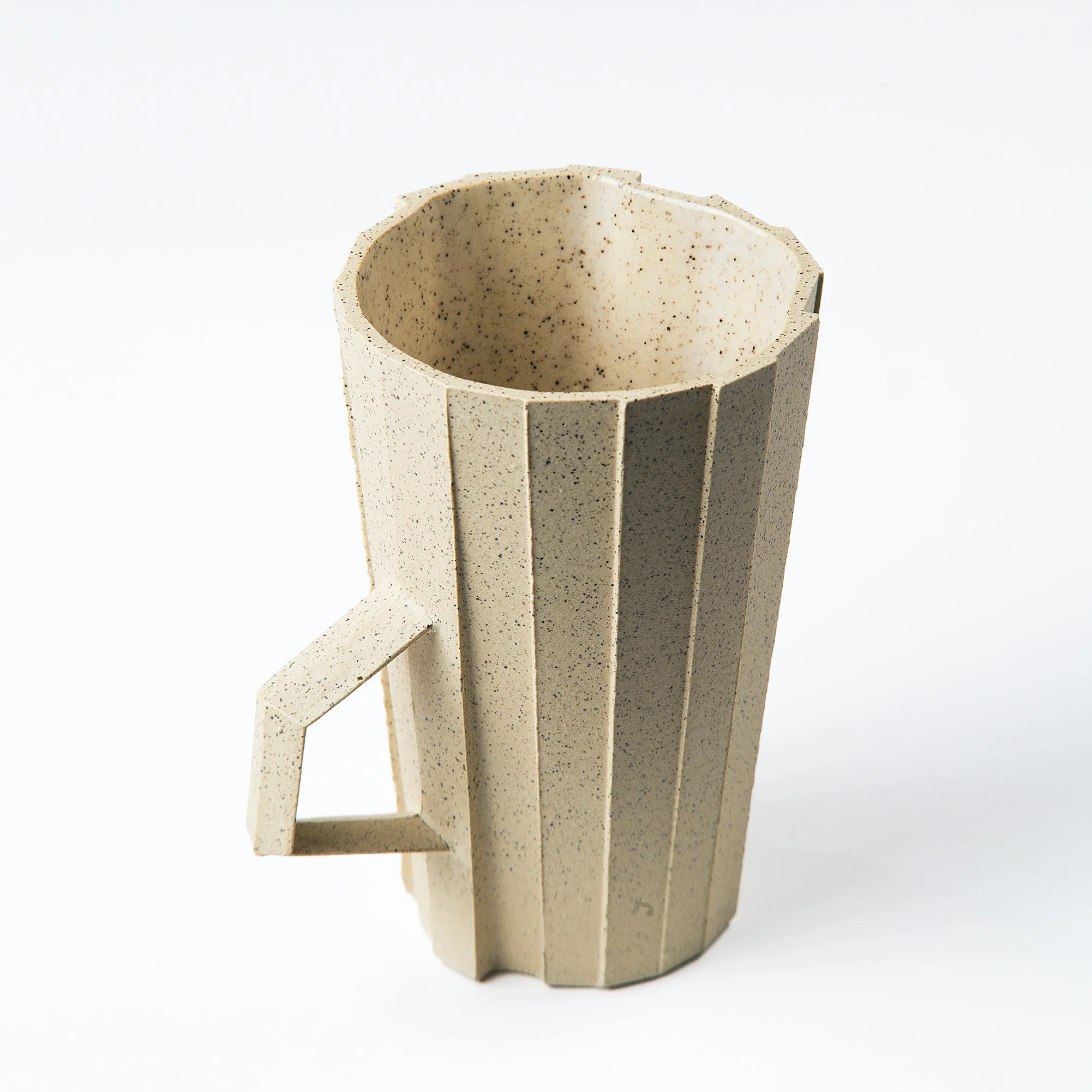 Handmade brutalist faceted ceramic cup in speckled buff stoneware, by Lea & Nicolas