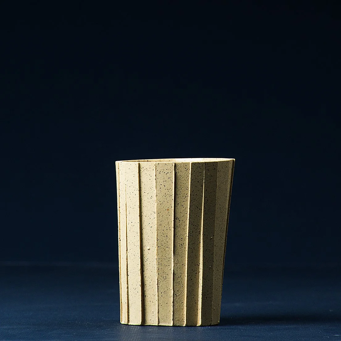Handmade brutalist faceted ceramic tumbler, speckled yellow stoneware, by Lea & Nicolas