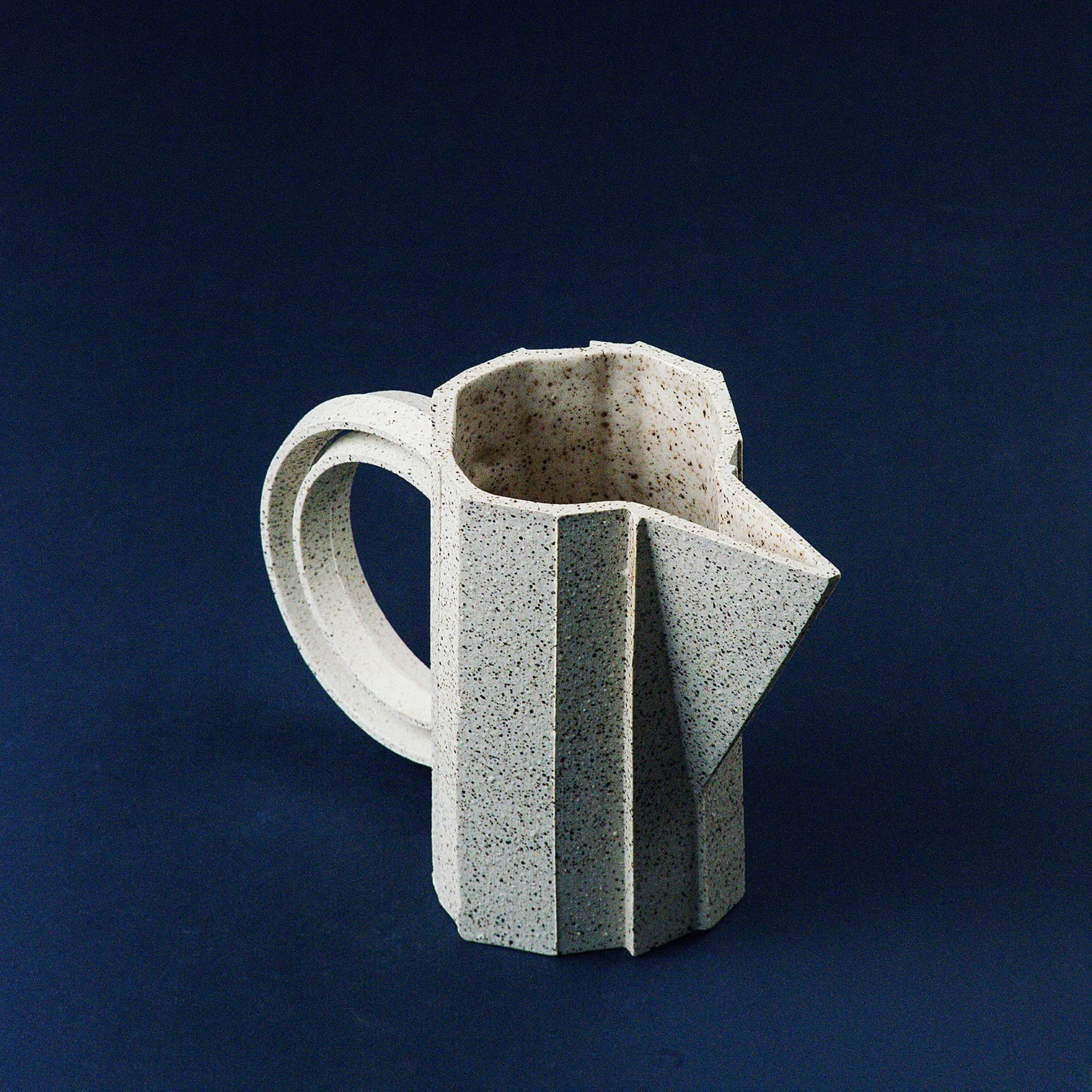 Handmade brutalist faceted ceramic pitcher in speckled stoneware, by Lea & Nicolas