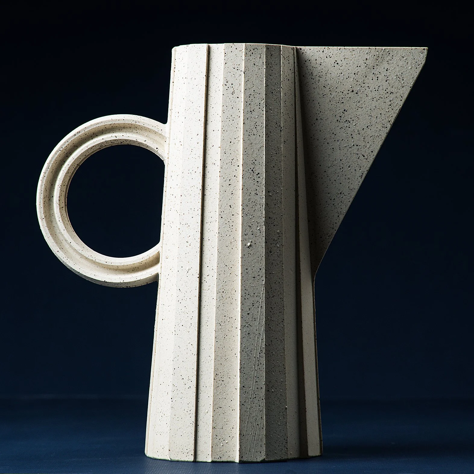Handmade faceted ceramic pitcher in speckled white stoneware, by Lea & Nicolas