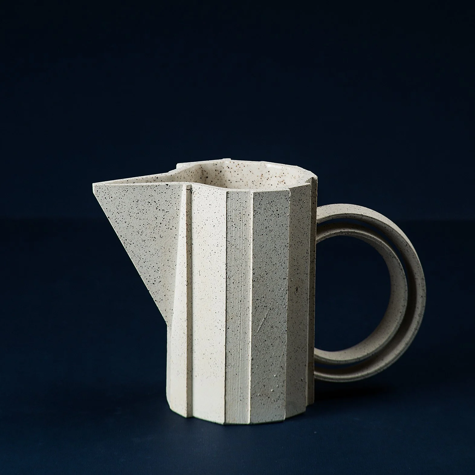 Handmade brutalist faceted ceramic pitcher in speckled stoneware, by Lea & Nicolas