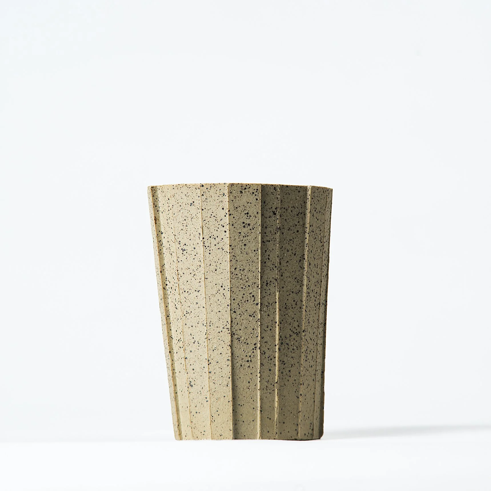 Brutalist handmade faceted ceramic tumbler in speckled buff stoneware, by Lea & Nicolas