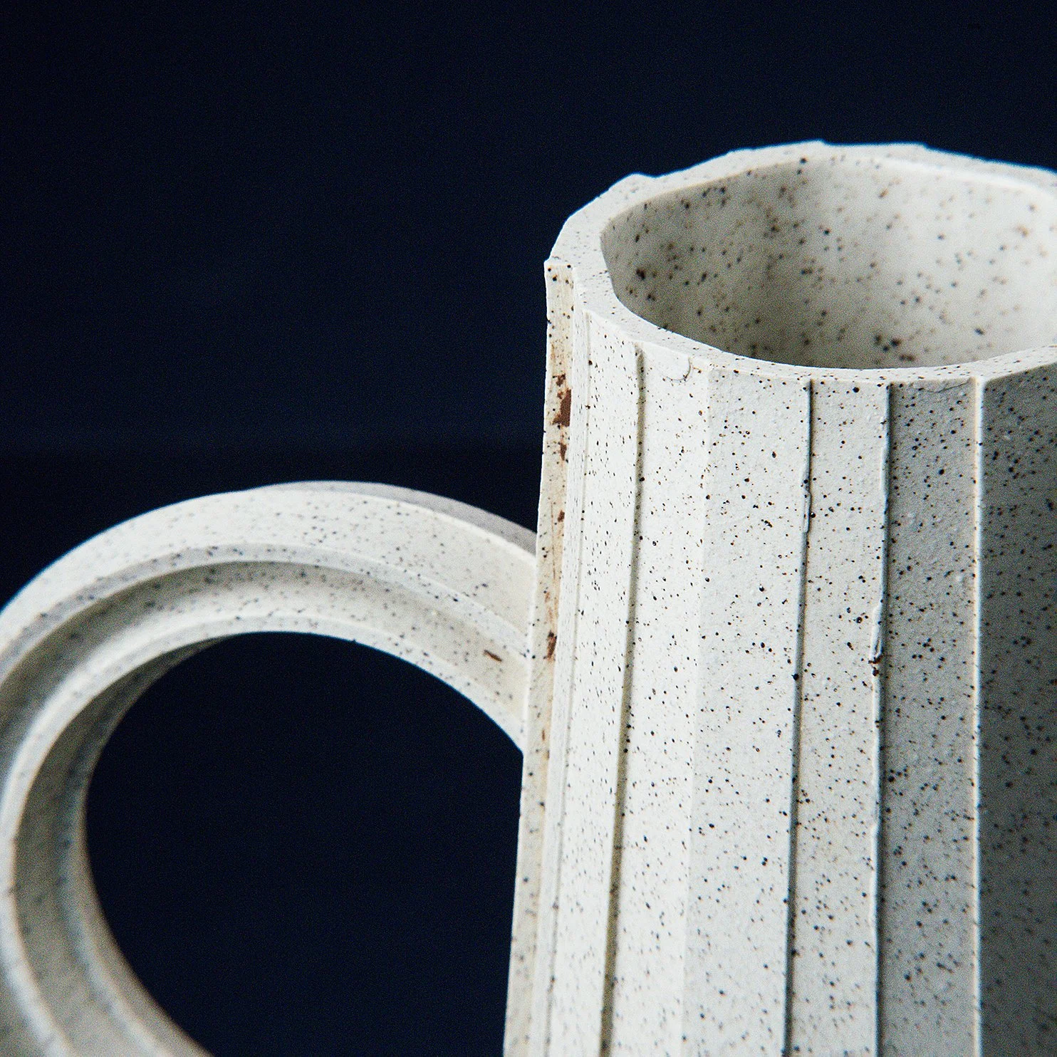 Handmade brutalist faceted ceramic pitcher in speckled stoneware, by Lea & Nicolas