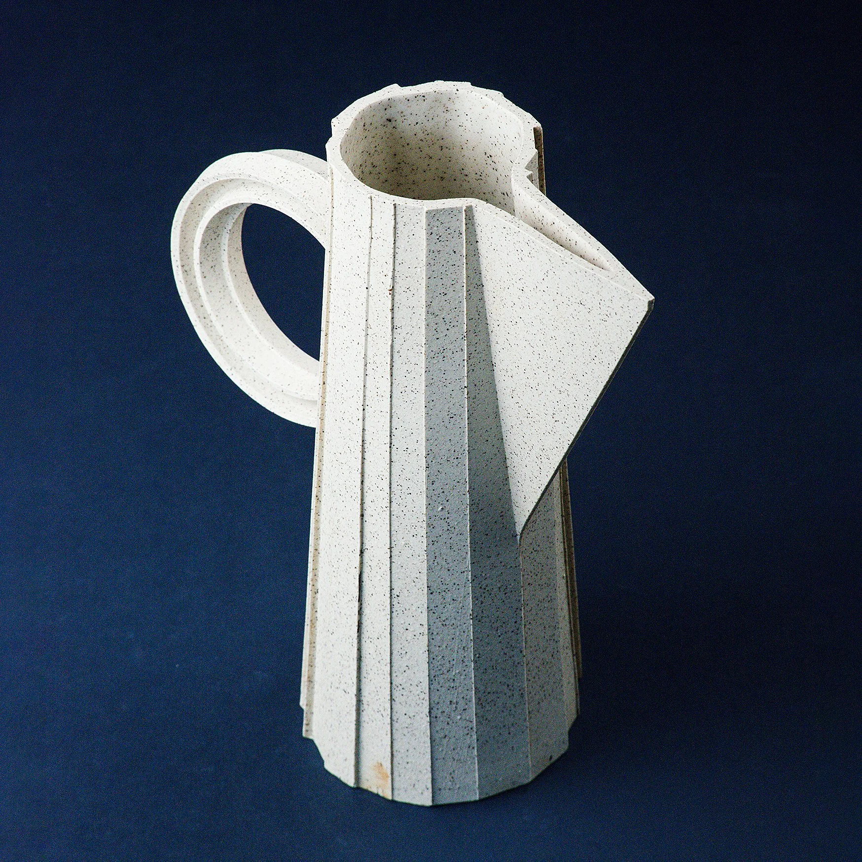 Handmade brutalist faceted ceramic pitcher in speckled stoneware, by Lea & Nicolas
