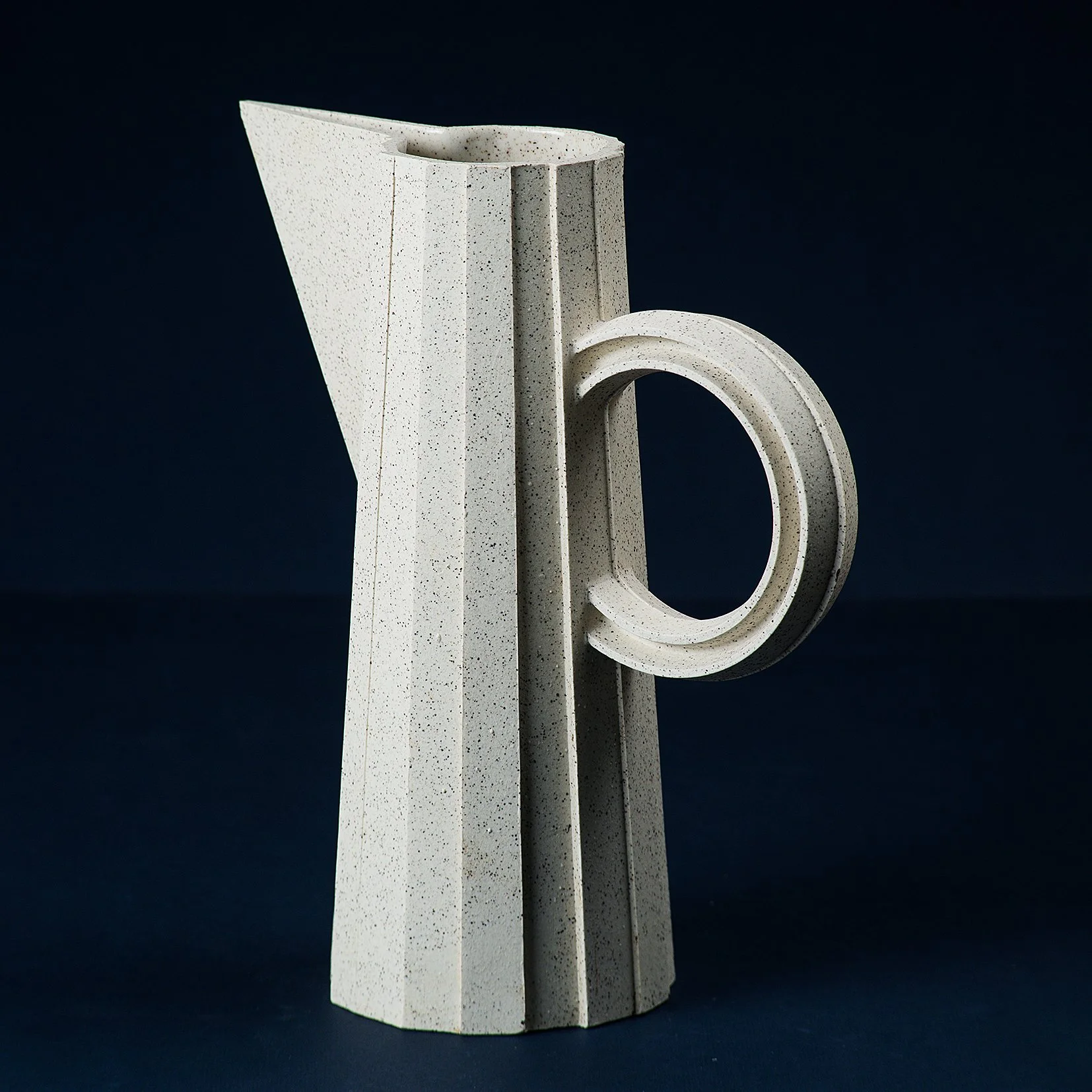 Handmade brutalist faceted ceramic pitcher in speckled stoneware, by Lea & Nicolas