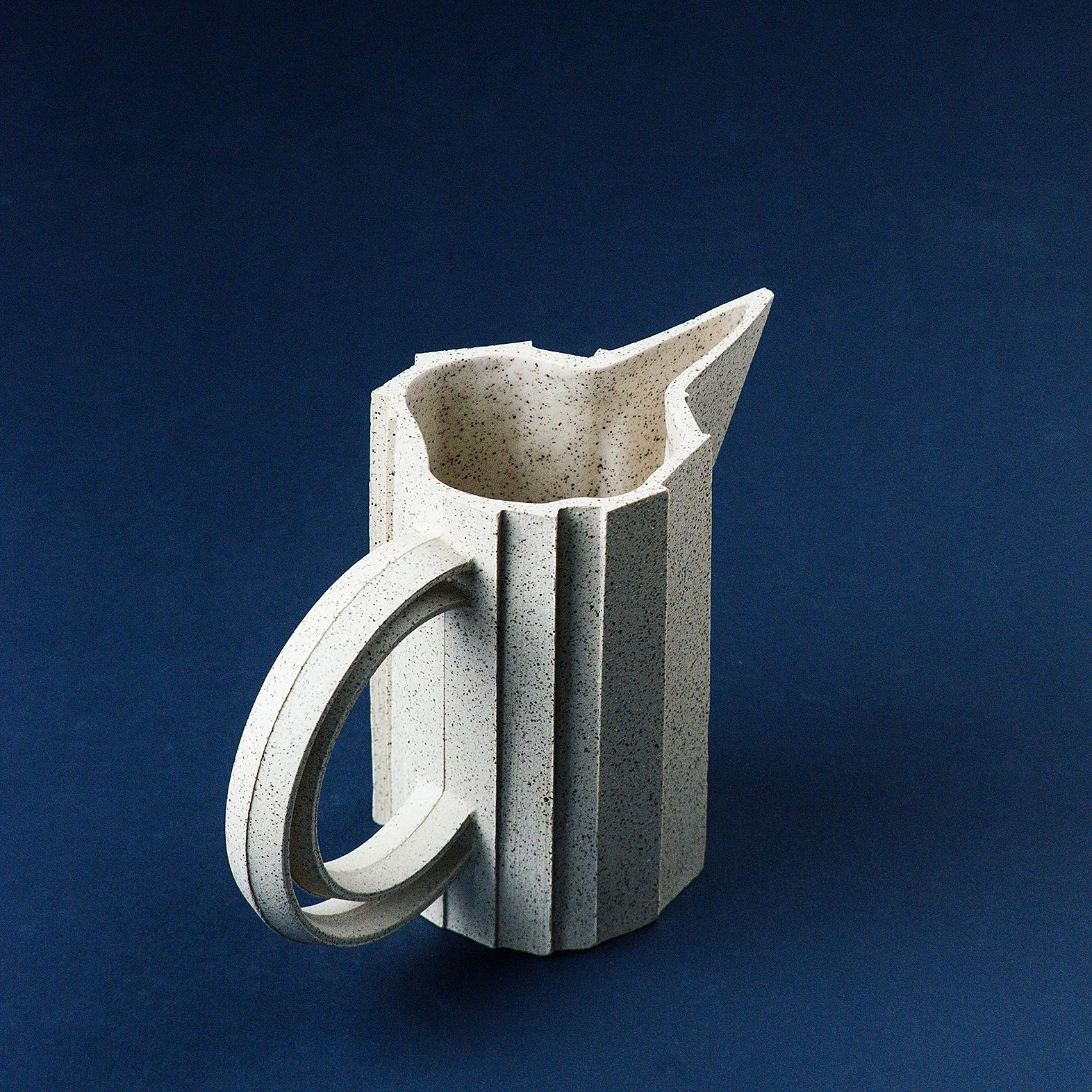 Handmade brutalist faceted ceramic pitcher in speckled stoneware, by Lea & Nicolas