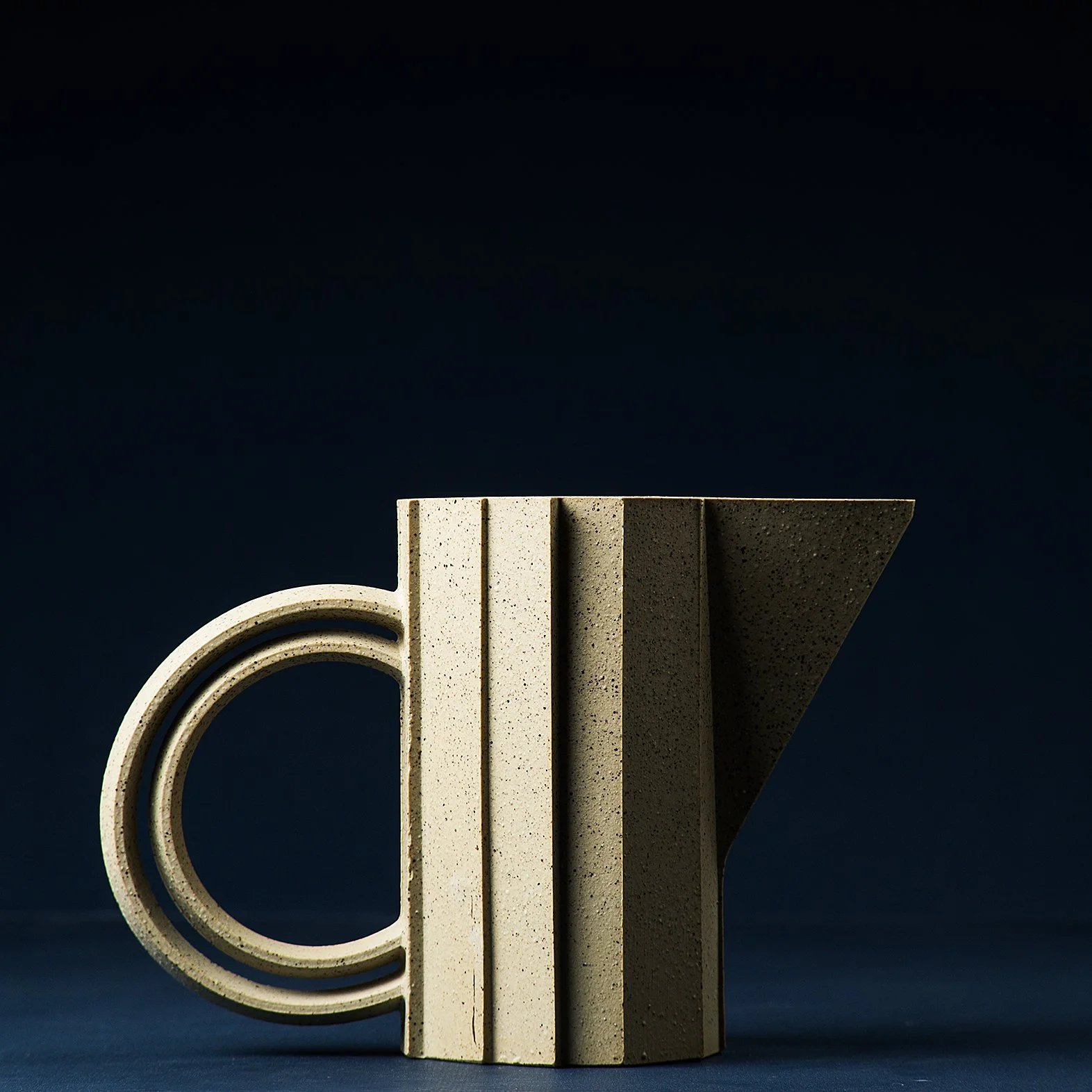 Handmade brutalist faceted ceramic pitcher in speckled stoneware, by Lea & Nicolas