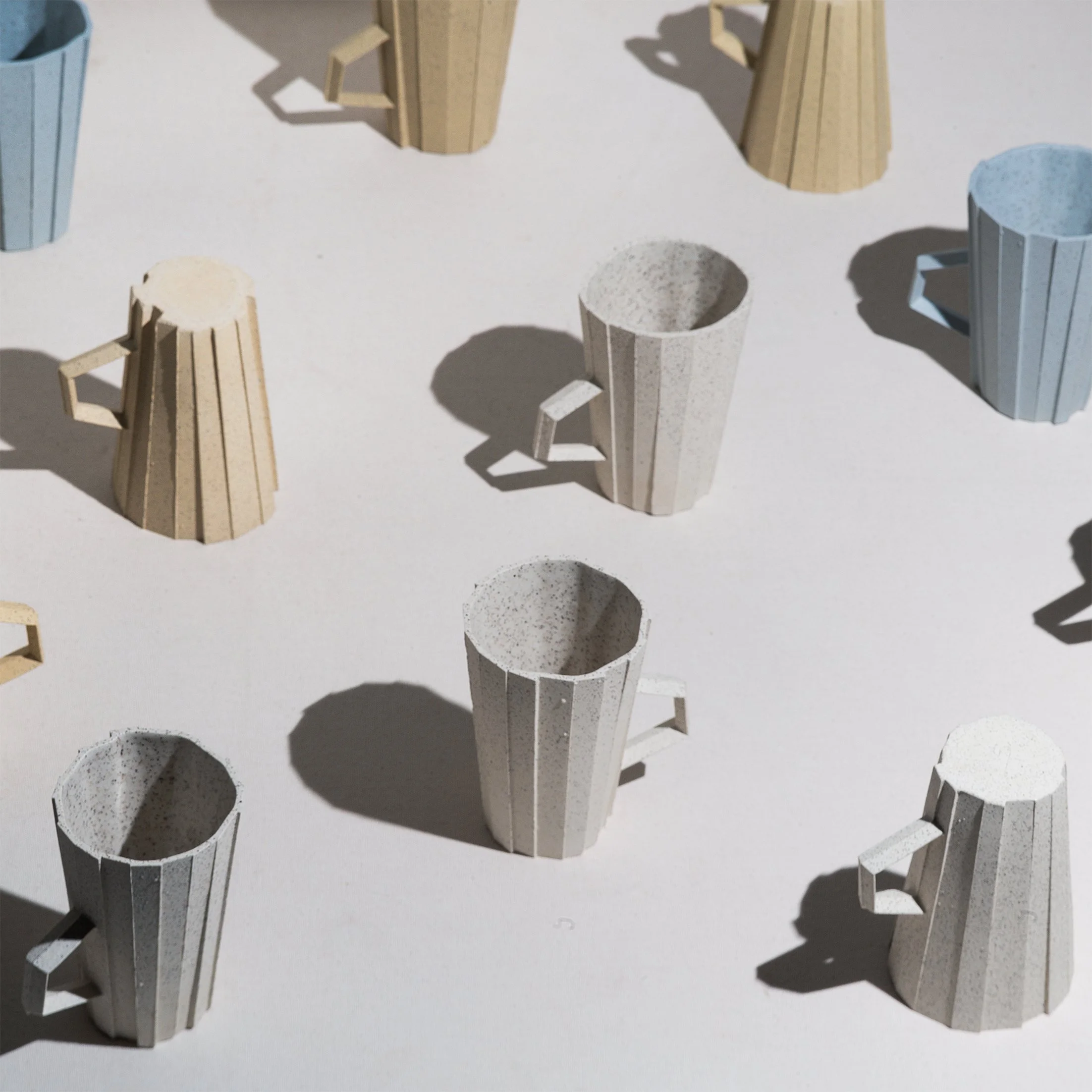 Handmade brutalist faceted ceramic cups by Lea & Nicolas