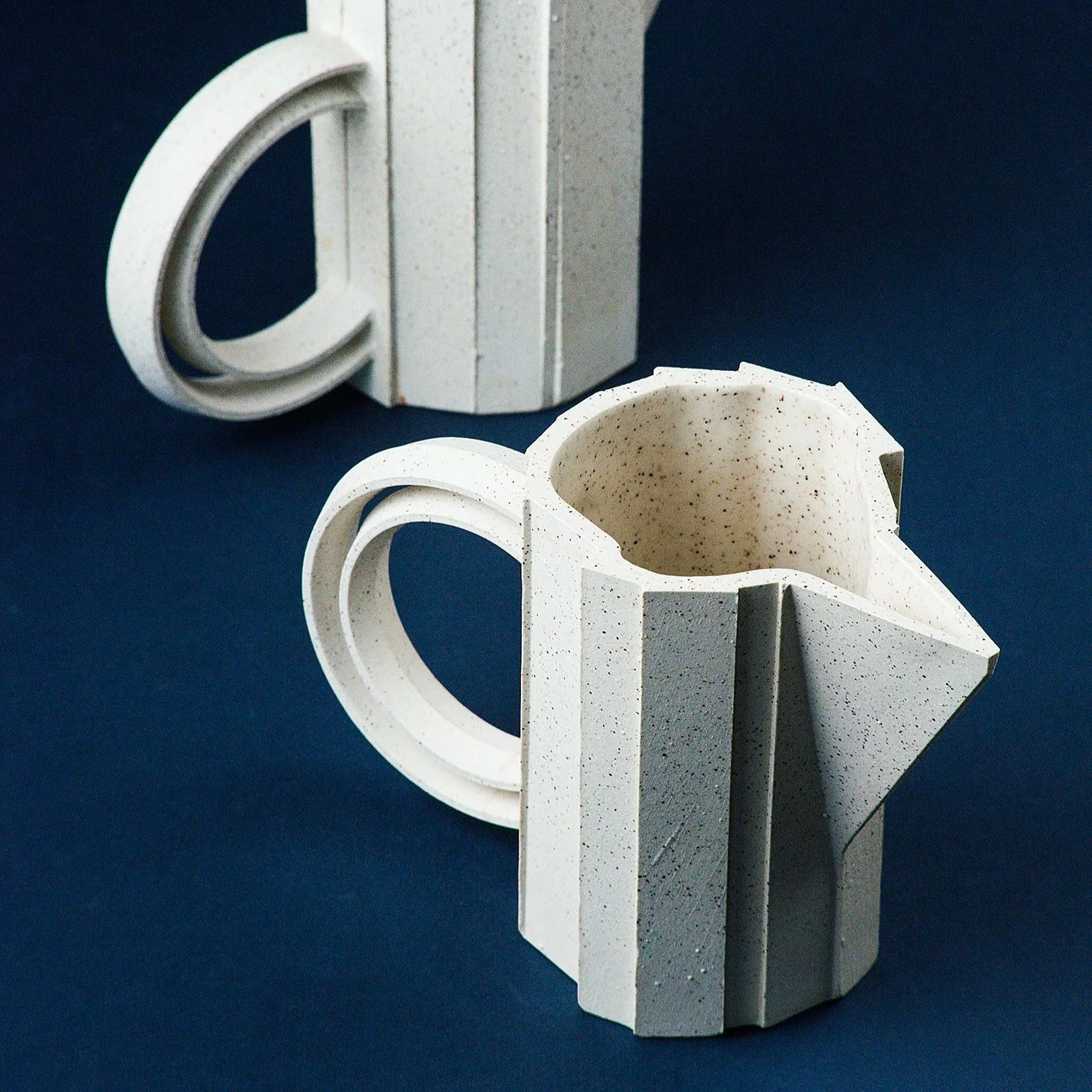 Handmade brutalist faceted ceramic pitcher in speckled stoneware, by Lea & Nicolas