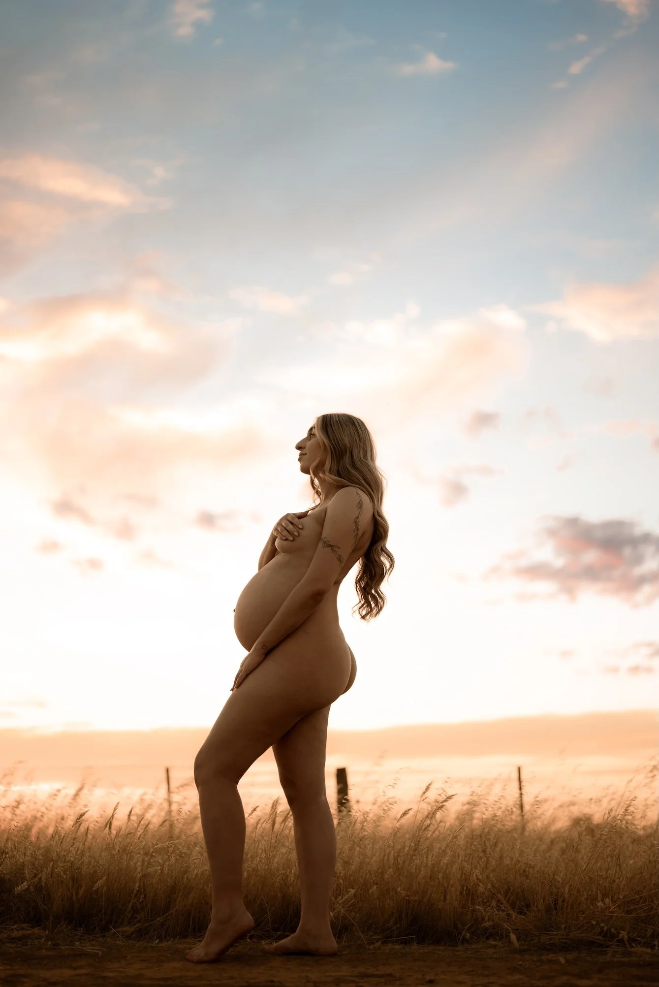 A pregnant mother during a maternity photo shoot. The mother who wants to remember it all, she wants to remember how it felt to carry life within her. Empowering, luxurious maternity photography. Calm, grounding, intimate. Echuca photographer. 