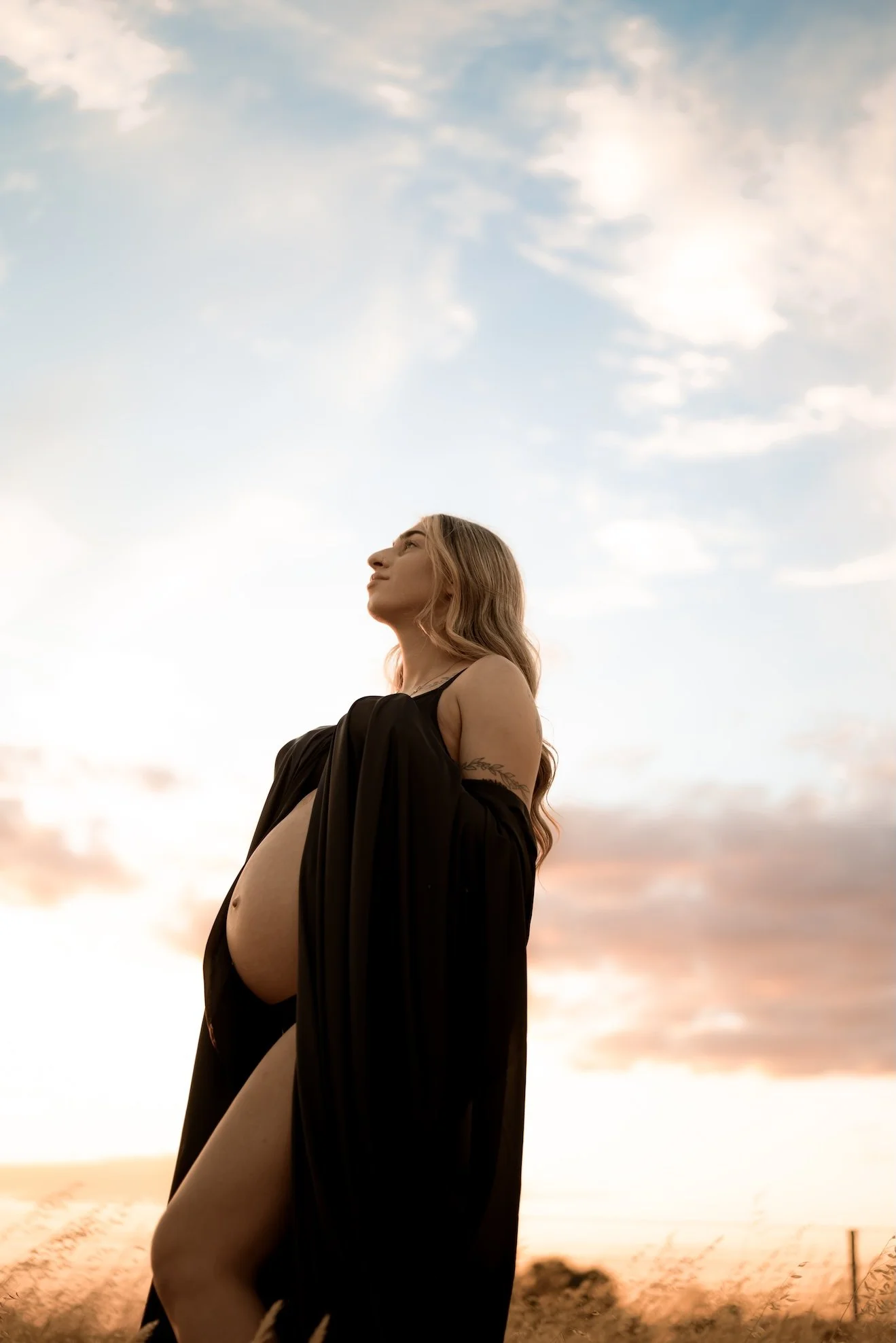 A pregnant mama during a maternity photo shoot. The mother who wants to remember it all, she wants to remember how it felt to carry life within her. Empowering, luxurious maternity photography. Calm, grounded, intimate. Echuca maternity photographer.