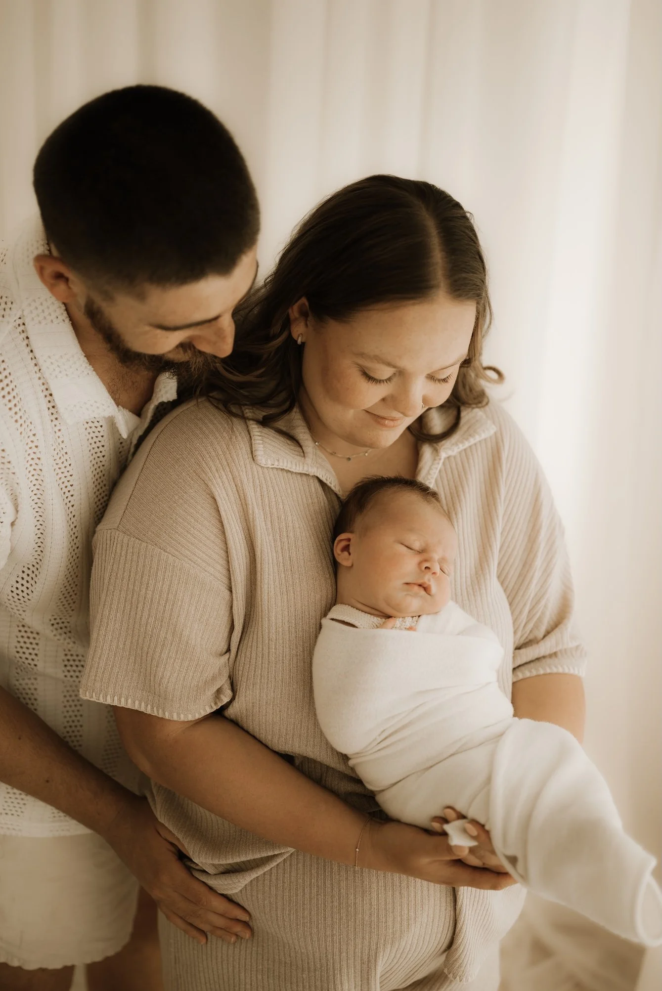 First time parents during a newborn photo shoot. Timeless, dreamy, calm, effortless newborn photography. For the mother who wants to remember it all, she wants to remember how small her baby was in the beginning. Echuca Newborn Photographer.