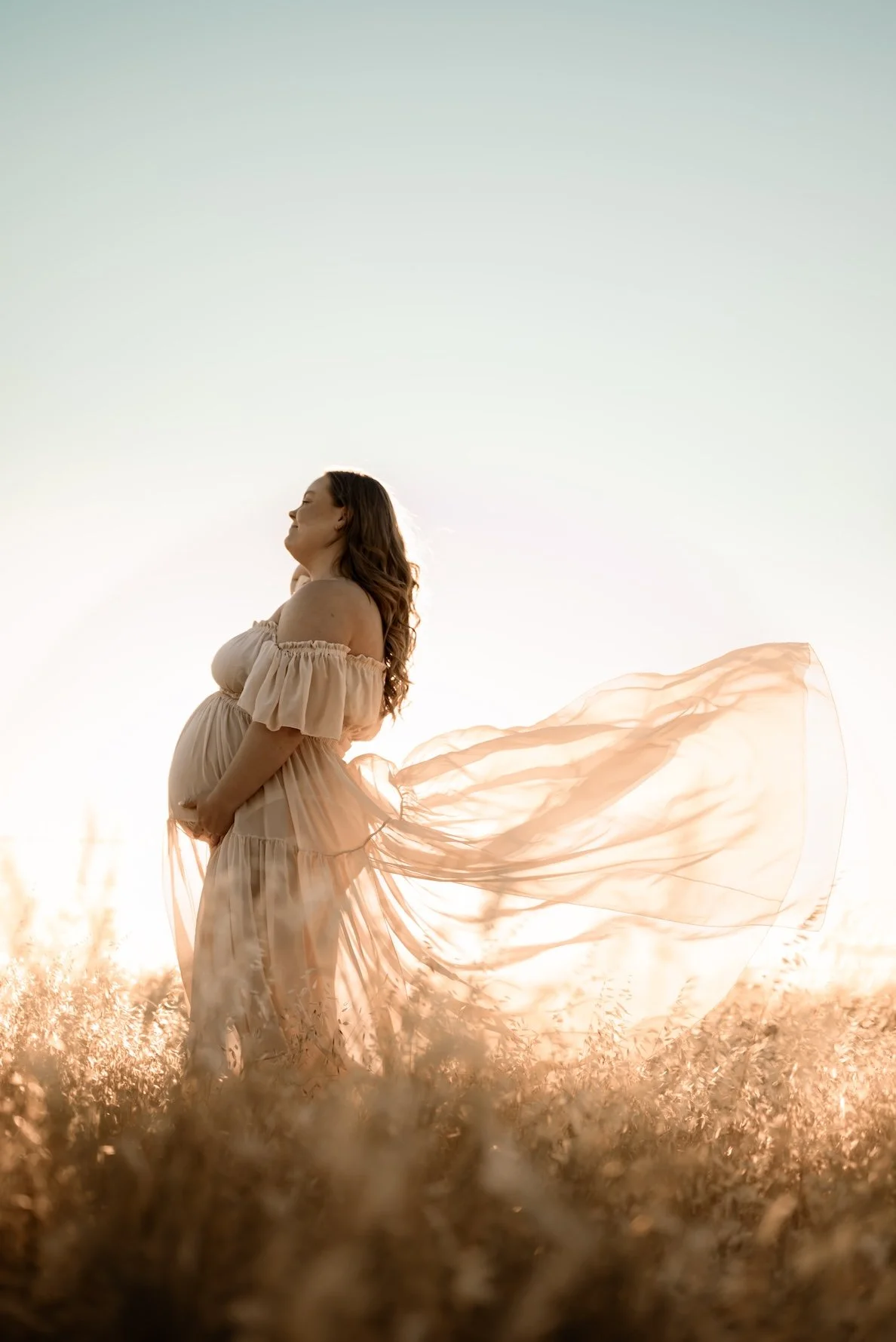 A pregnant mama during a maternity photo shoot. The mother who wants to remember it all, she wants to remember how it felt to carry life within her. Empowering, luxurious maternity photography. Calm, grounded, intimate. Echuca maternity photographer.