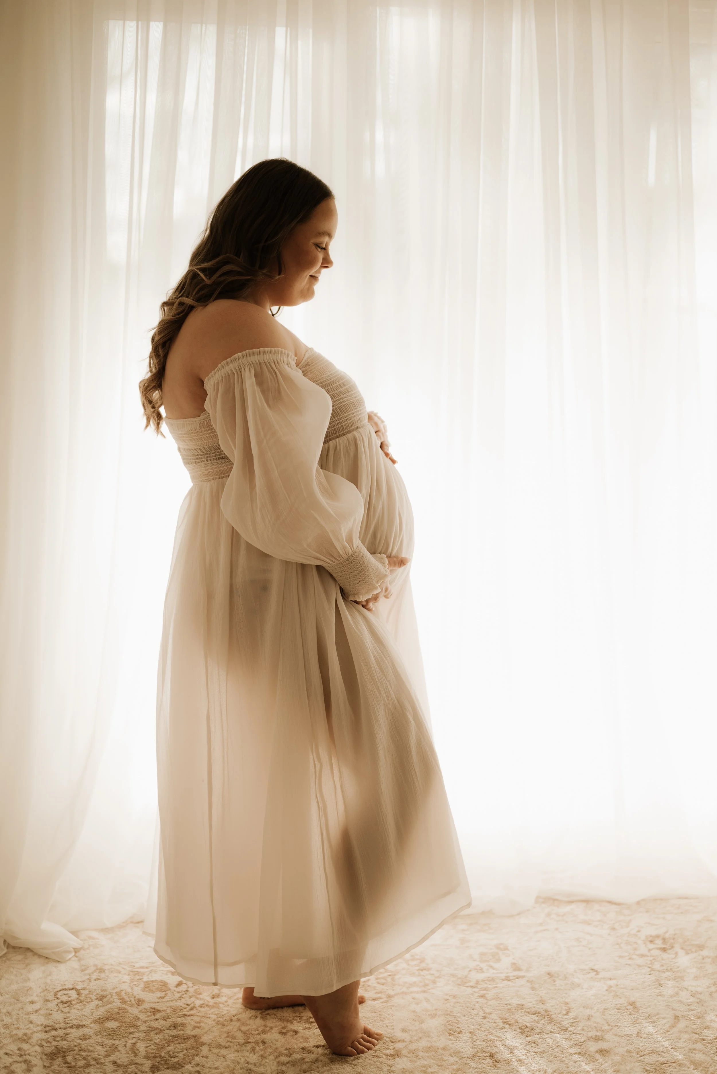 A pregnant mama during a maternity photo shoot. The mother who wants to remember it all, she wants to remember how it felt to carry life within her. Empowering, luxurious maternity photography. Calm, grounded, intimate. Echuca maternity photographer.