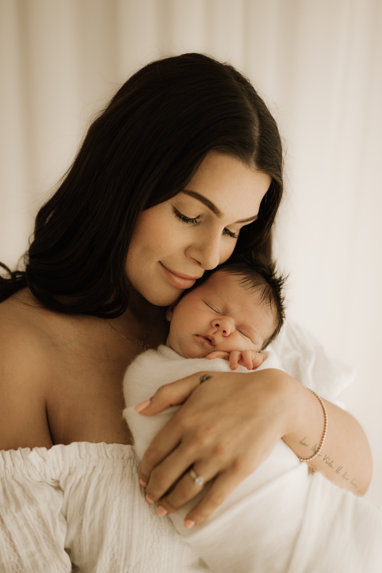First time mama during a newborn photo shoot. Timeless, dreamy, calm, effortless newborn photography. For the mother who wants to remember it all, she wants to remember how small her baby was in the beginning. Echuca Newborn Photographer. 