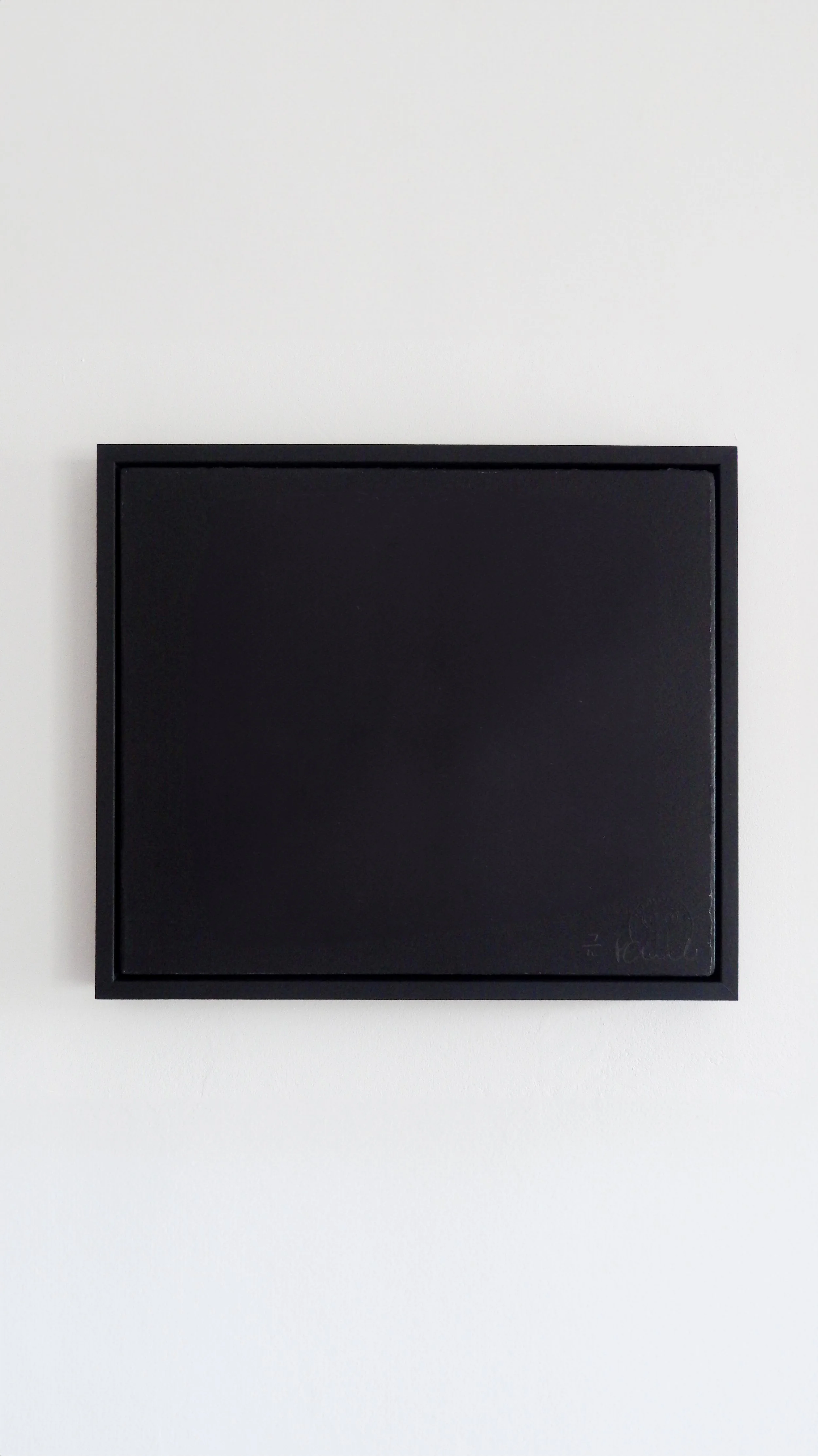 digitally manipulated black-coloured square-shaped silkscreen artwork in a black frame