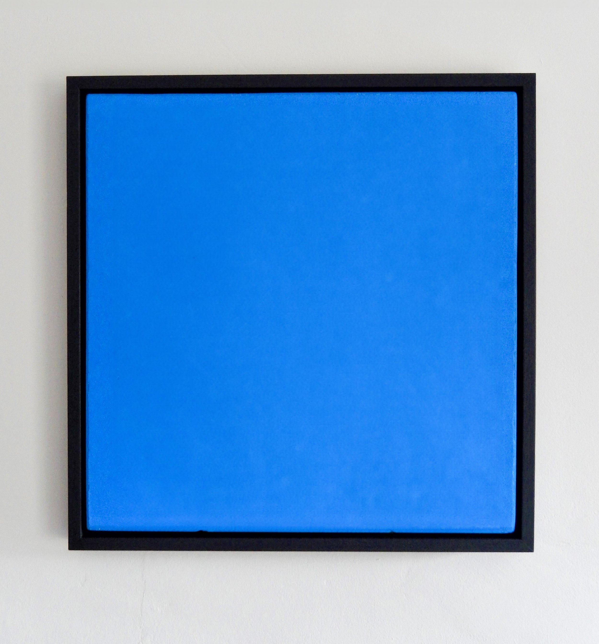 digitally manipulated mid-blue-coloured square-shaped silkscreen artwork in a black frame