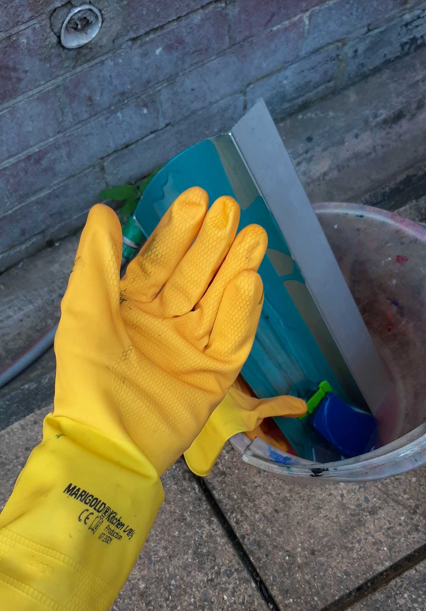 A Marigold glove worn ready clean photo emulsion supplies
