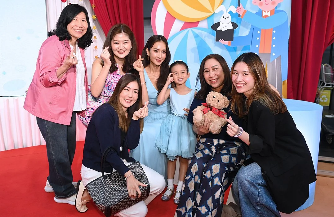 Group of people posing at a corporate event