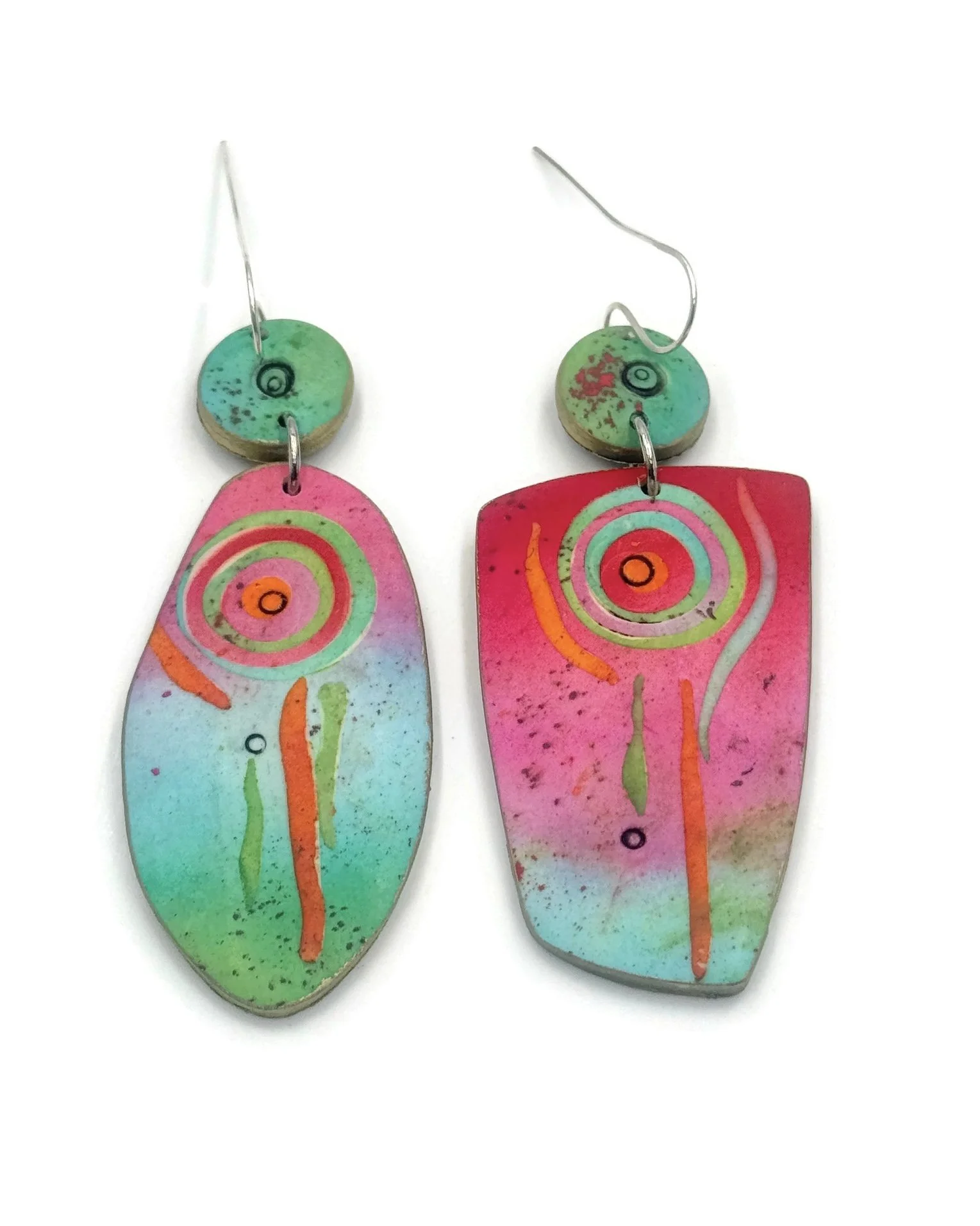 Handmade mismatched polymer clay earrings with colorful abstract painted patterns in pink, green, aqua, and orange