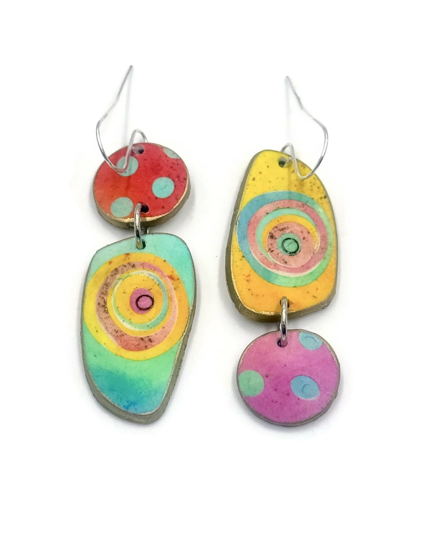 Handmade mismatched earrings in colorful oval and circle shapes. Bright, bold and easy to wear.
