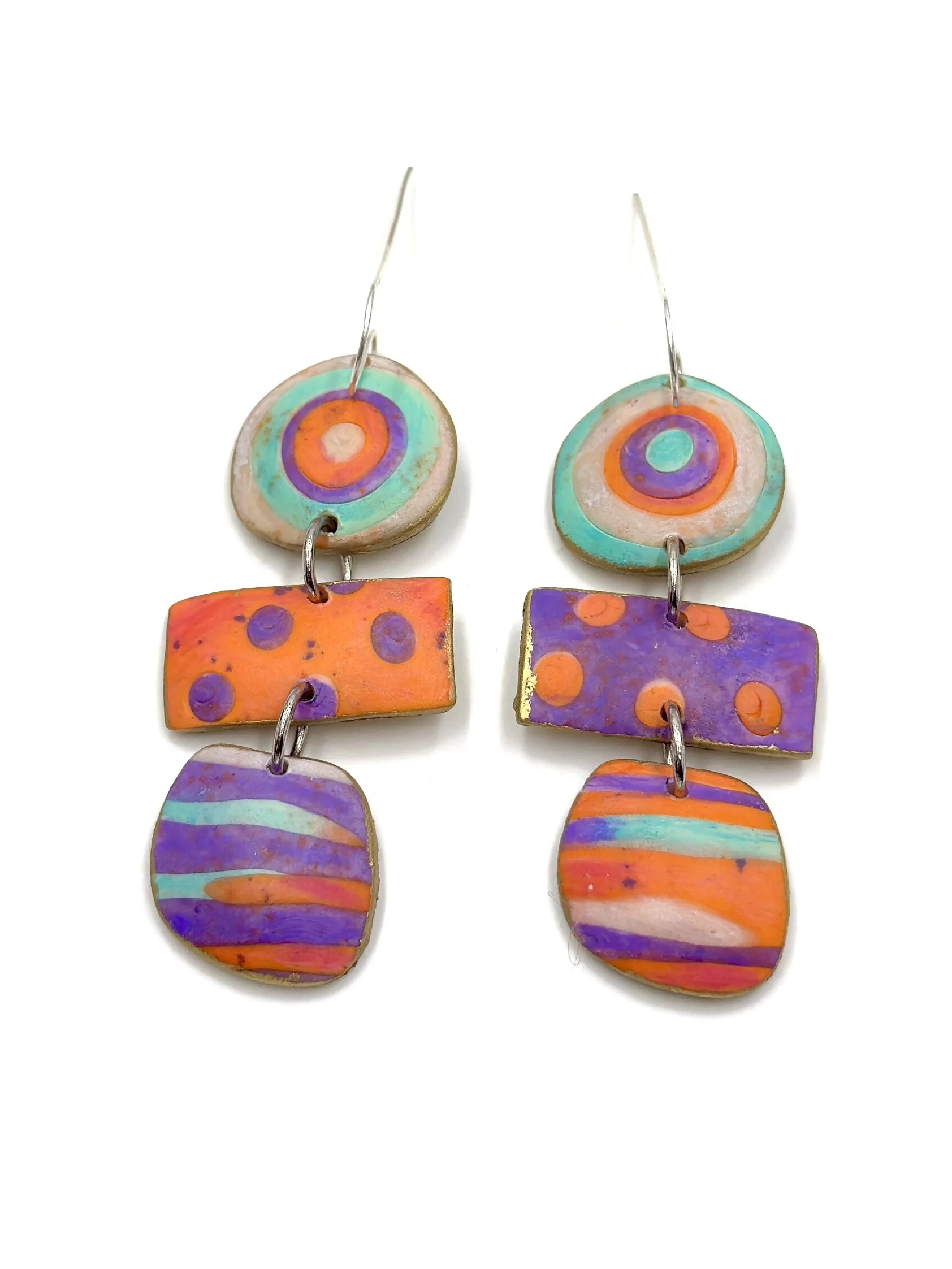 Handmade colorful drop earrings with circles, dots and stripes in orange, purple and turquoise tones