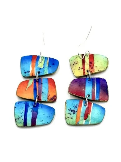 Handmade drop earrings with colorful stripe patterns in blue, turquoise, orange, and purple tones