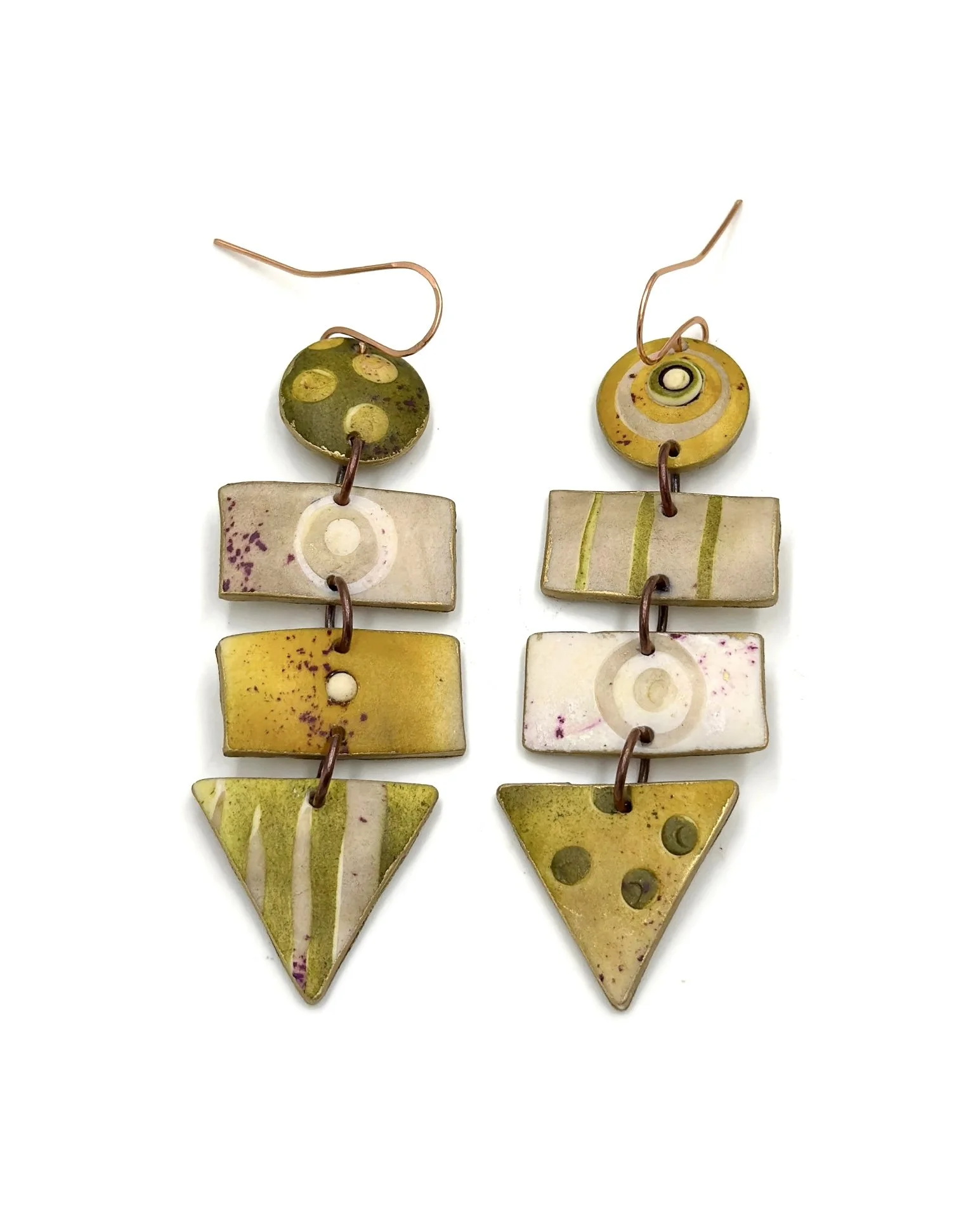 Handmade geometric drop earrings in olive green, mustard, and cream tones with layered shapes and painterly textures