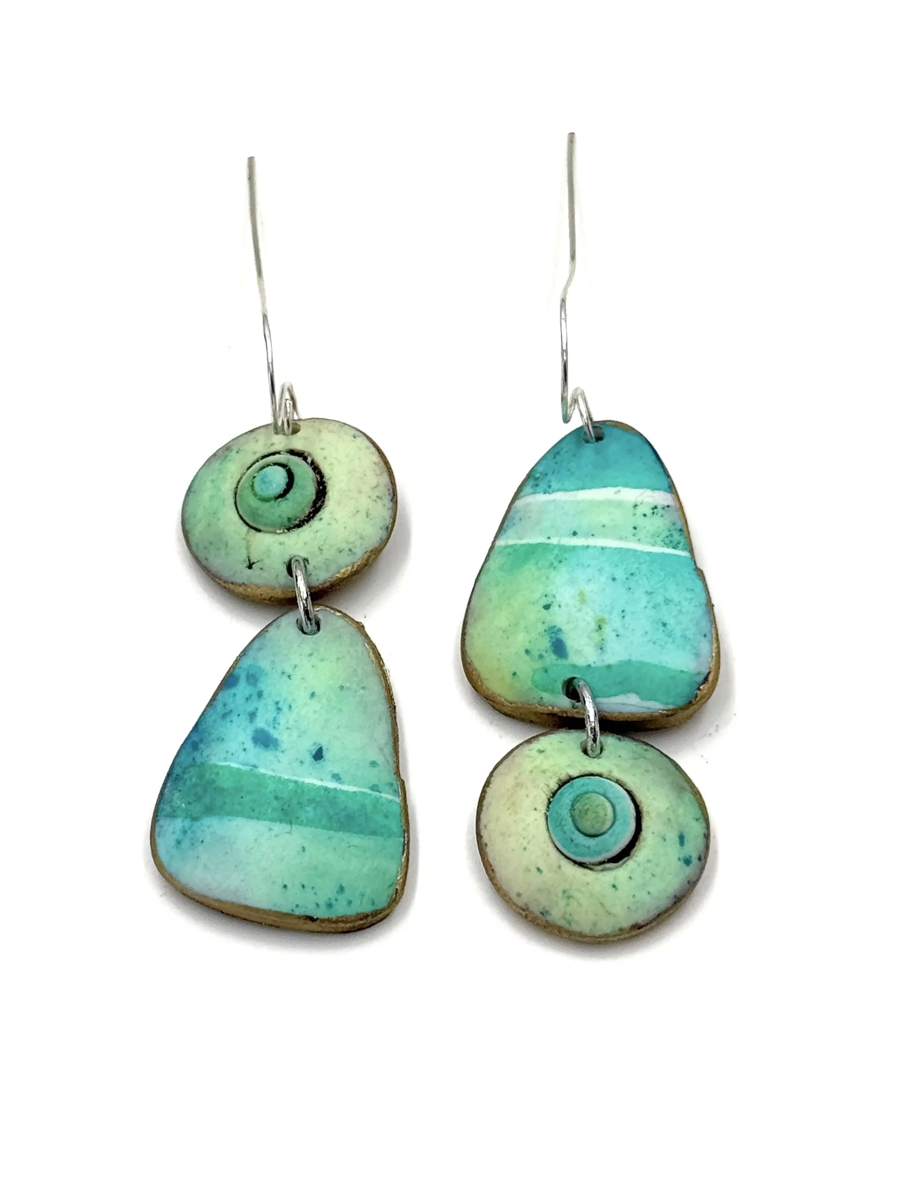 Handmade asymmetrical drop earrings in turquoise and mint green tones with circular details and organic shapes