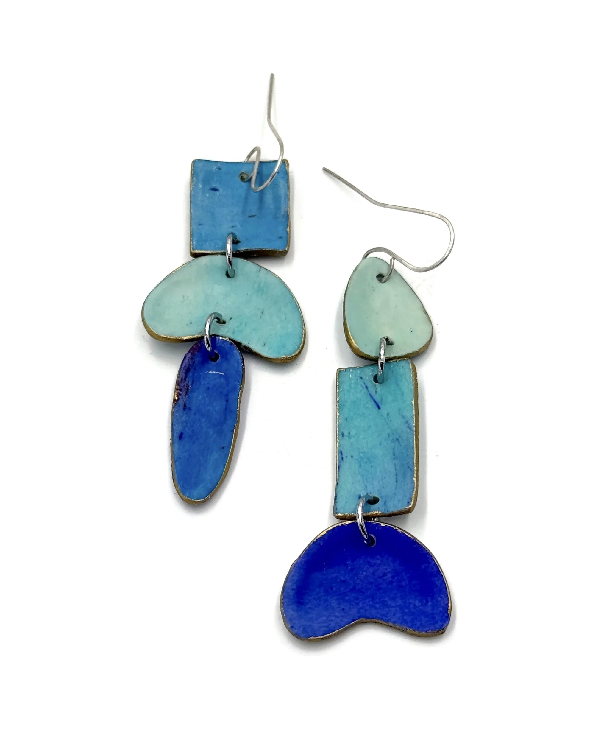 Handmade asymmetrical drop earrings in cobalt blue, turquoise, and aqua tones with geometric and organic shapes