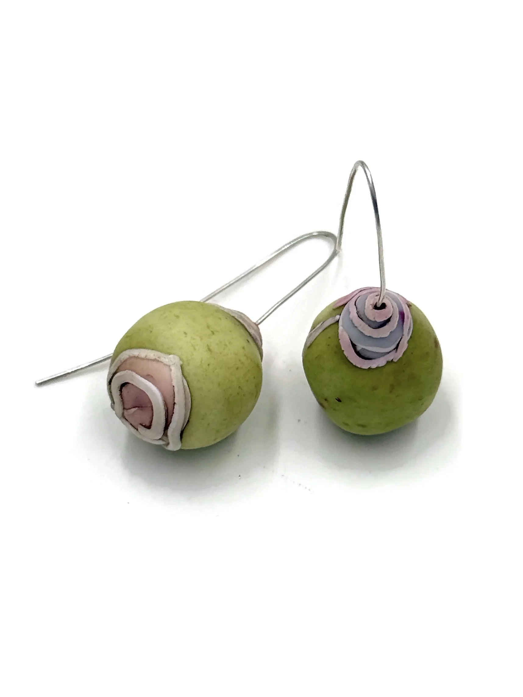 Handmade sculptural orb earrings in sage green with layered ciel blue, pink, and off-white details and sterling silver ear wires.