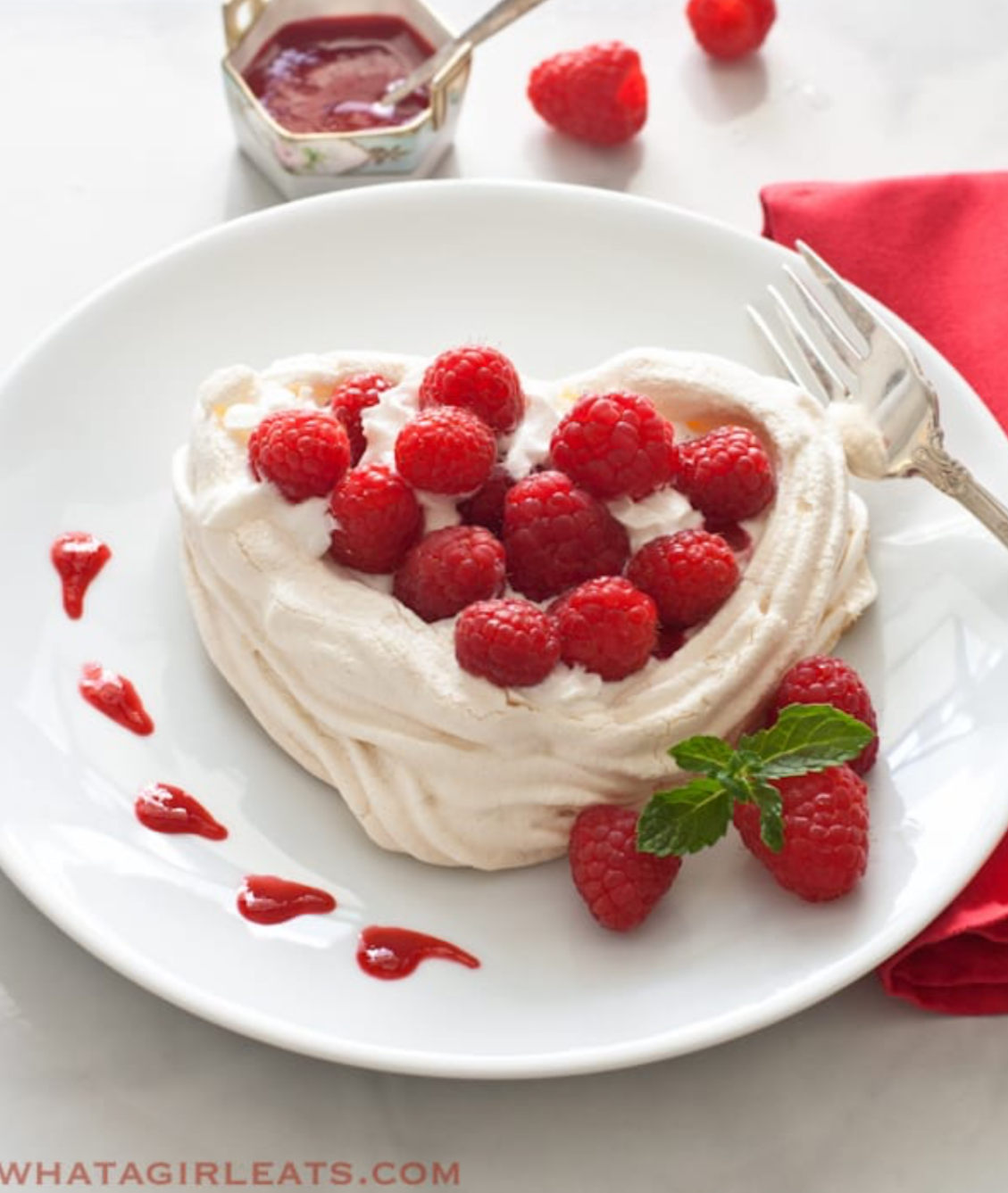 Meringue Hearts With Whipped Cream And Raspberries