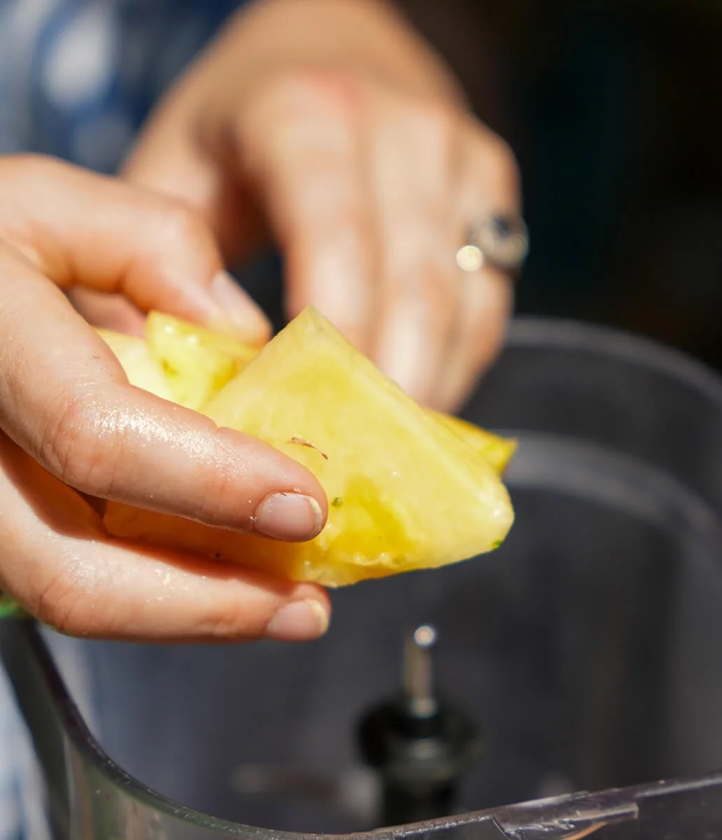 Pineapple being added to a smoothie in the G&S smoothie station