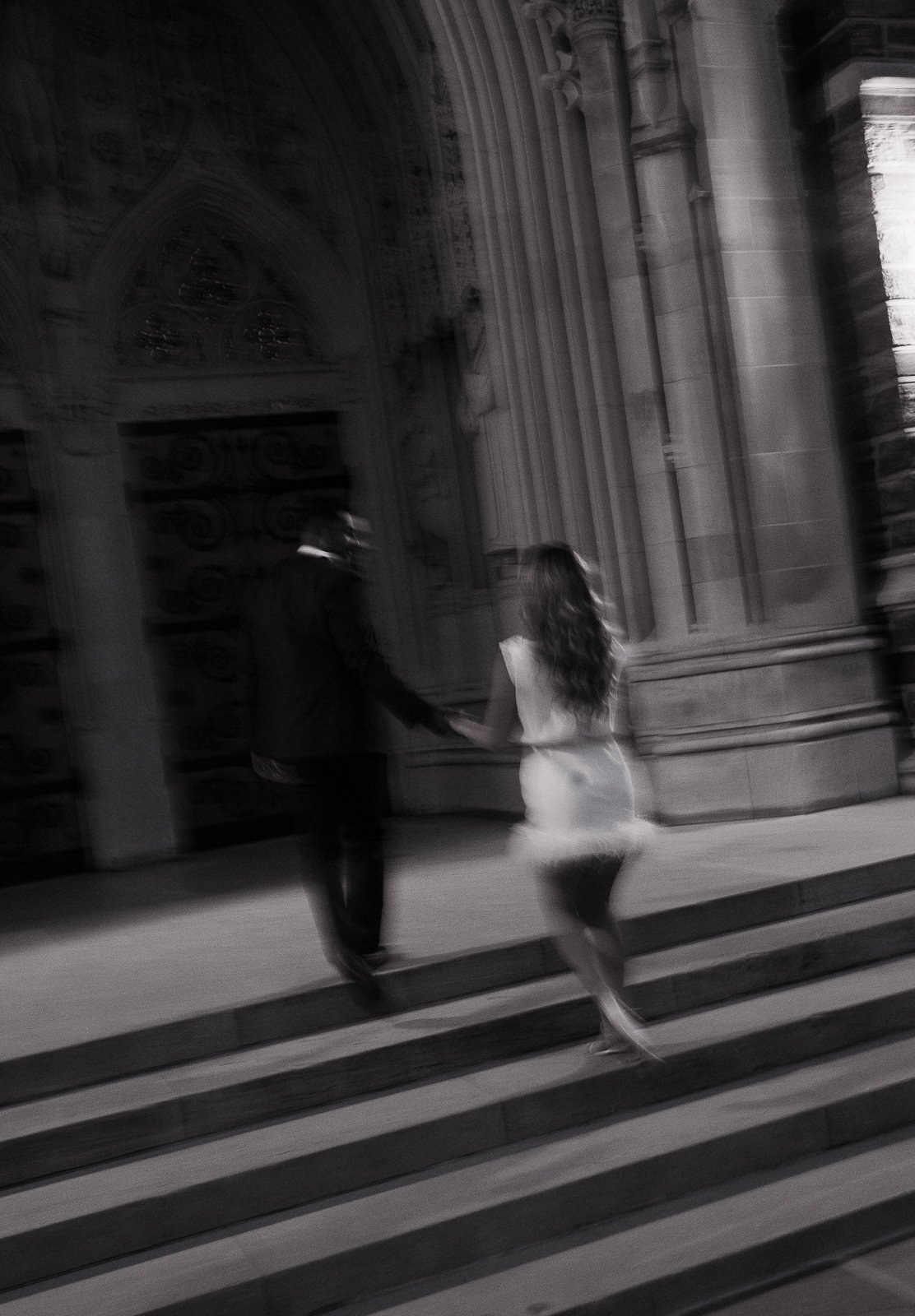 Motion blur of fiances walking up the stairs at Duke Chapel at Duke University, NC