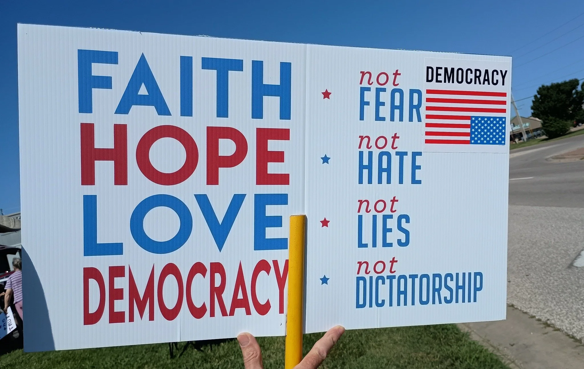 protest sign saying faith hope love democracy as posted to butler county democrats private page aug 2025 by local volunteer.jpg