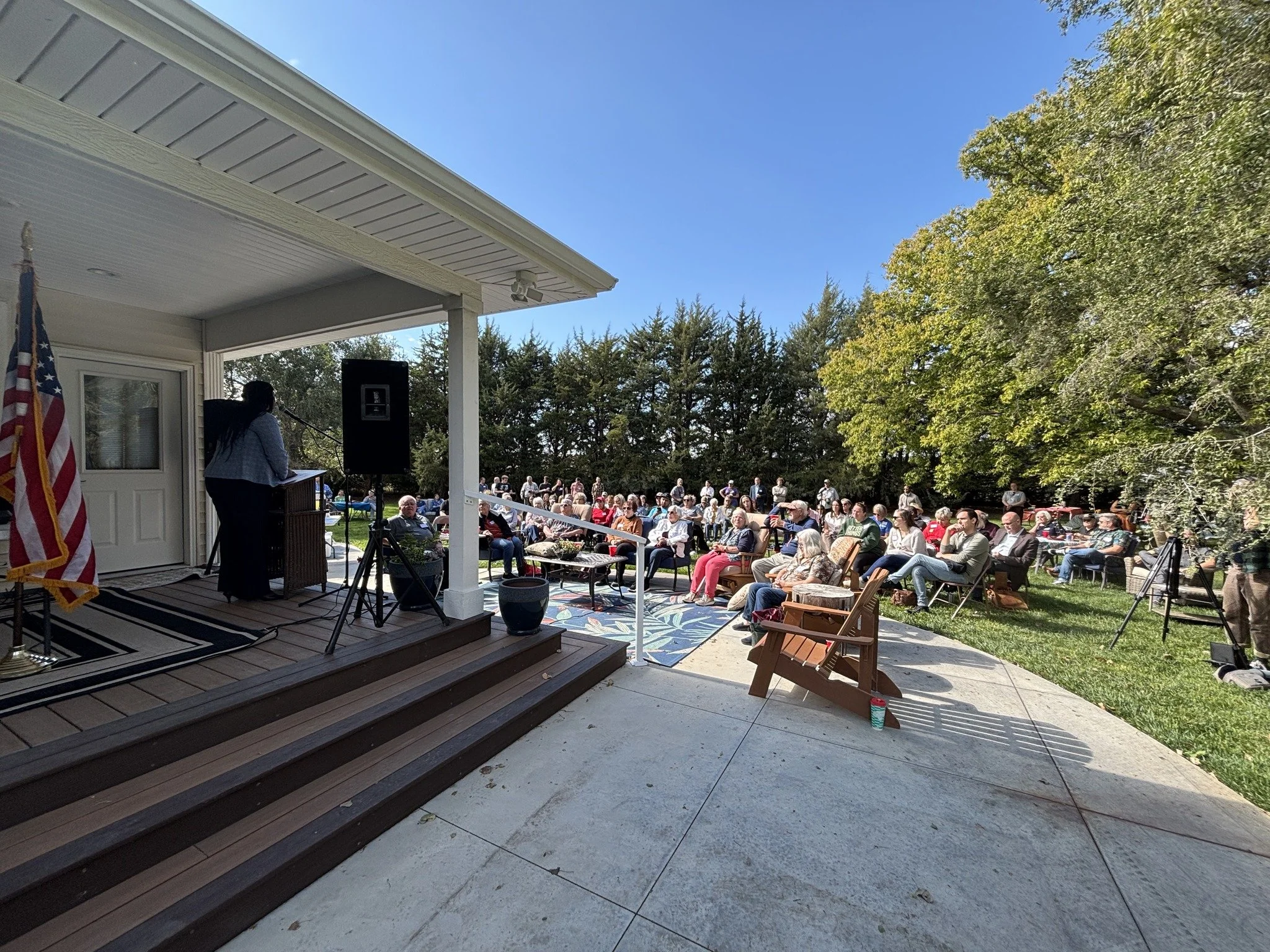Democracy Fest Hays Oct 18 2025 Crowd by porch.jpg