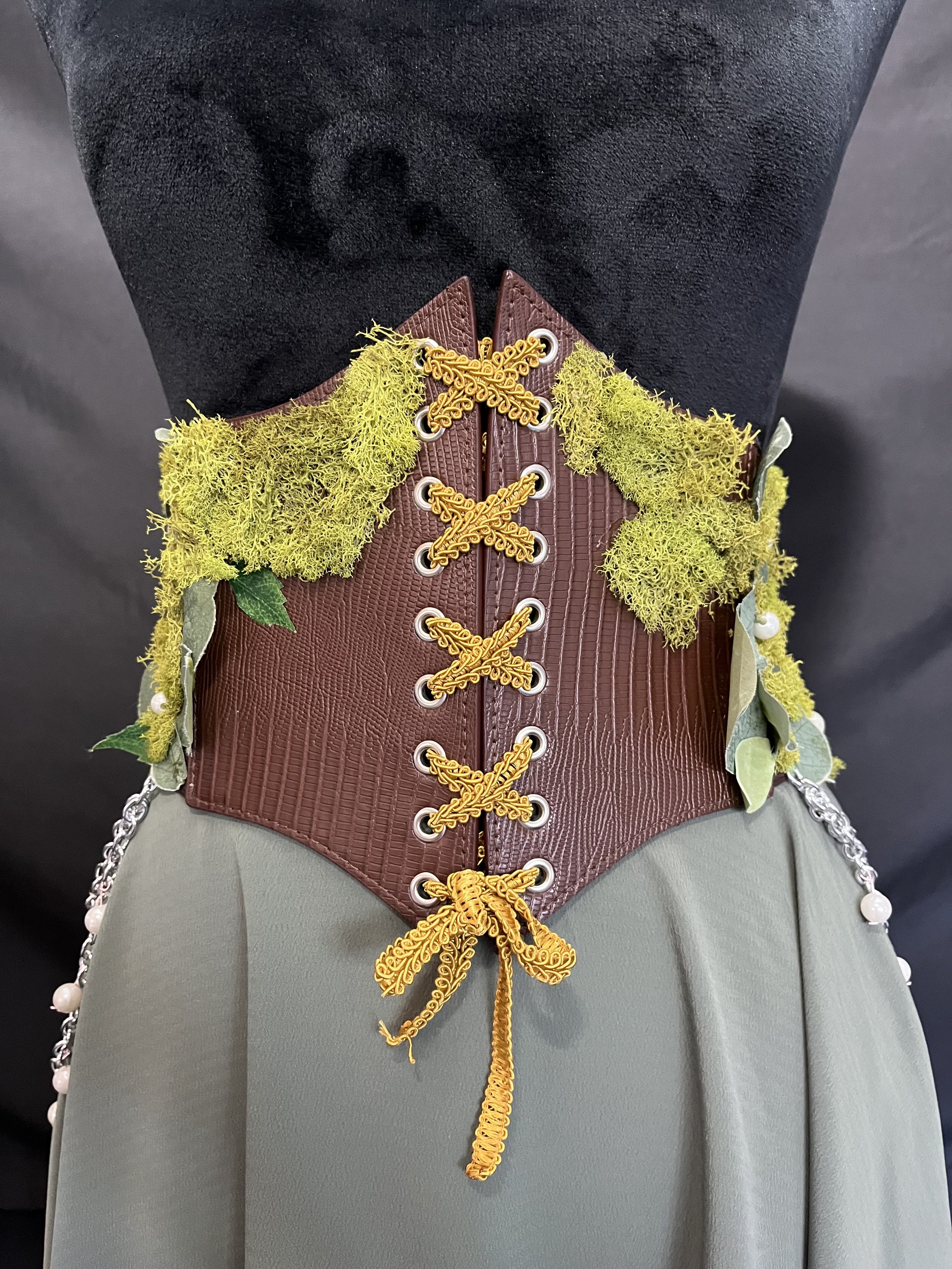 Foux leather corset belt embellished with Foux and embroidered moss, leaves, and hand sewn pearl beads