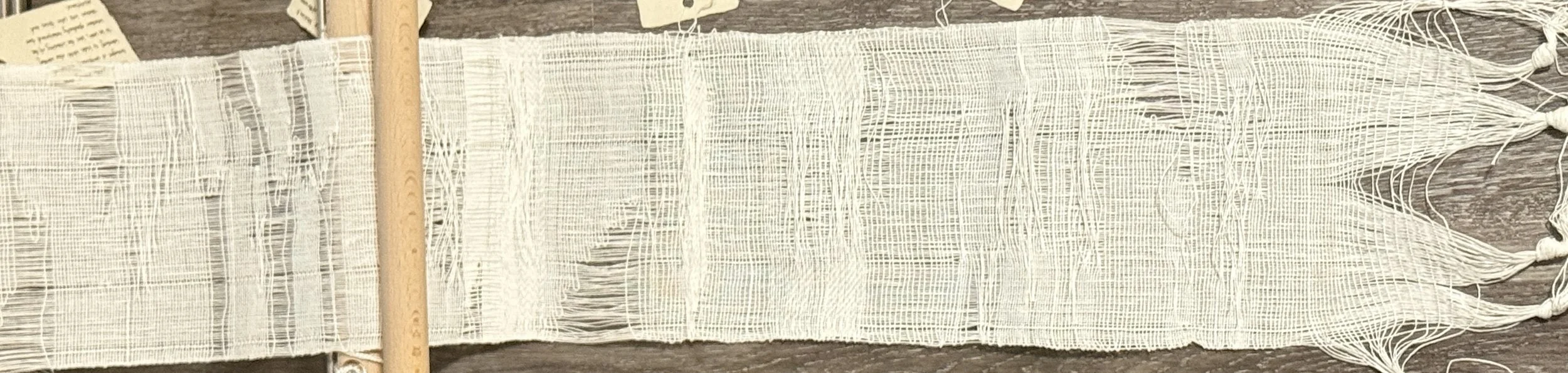 Composite view of all woven cloth from the Toronto performances, showing how density, open-work, and accidental gaps varied across the Toronto sessions. Photograph by Yuting Zhou, 2026.