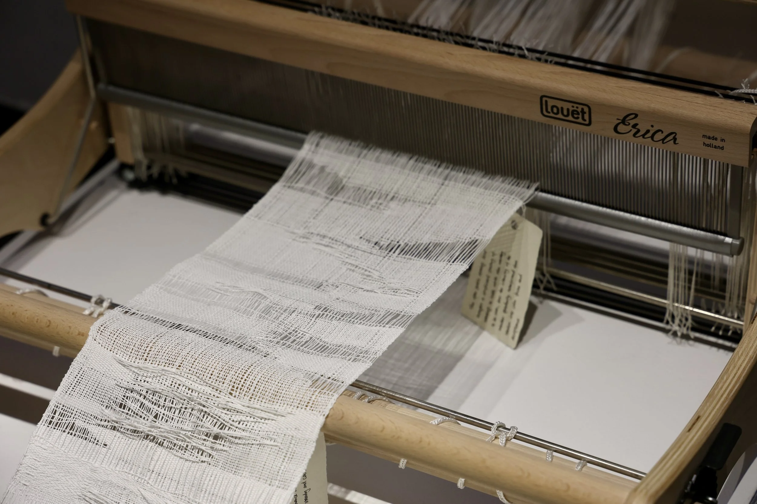 Detail of the labelled woven cloth on Loom 1. Photograph by Aritra Das, 2026.