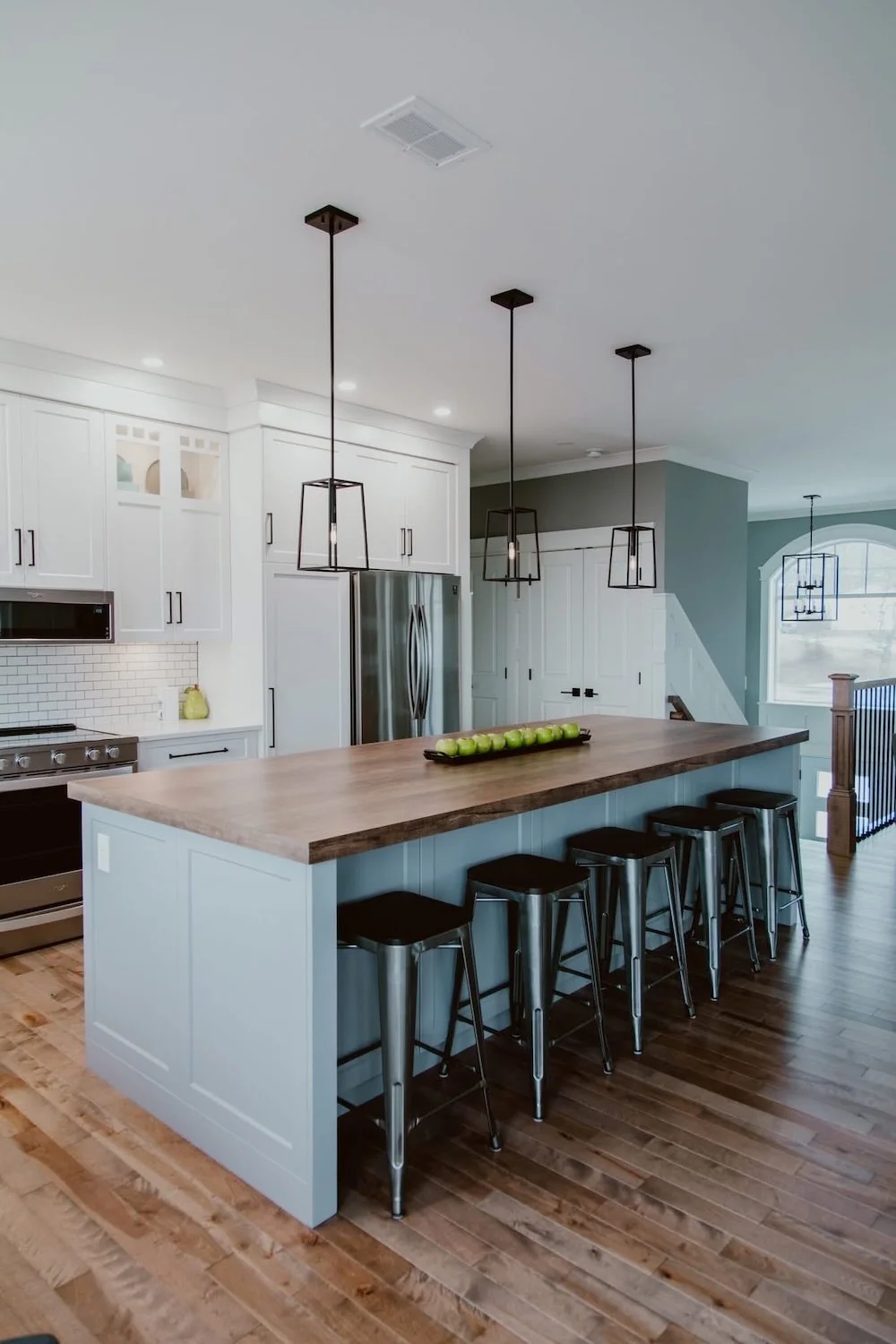 Open concept kitchen reno completed through a design-build renovation process with modern finishes.