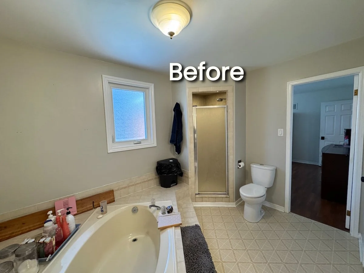 Before Bathroom remodel: closed-off shower and worn tile flooring
