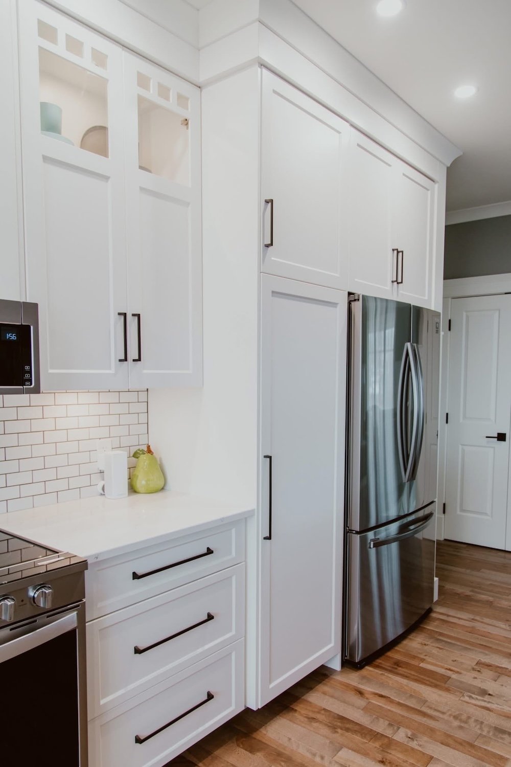 Full kitchen remodel completed through a design-build renovation process featuring custom cabinetry, quartz countertops, and modern layout in Durham Region.