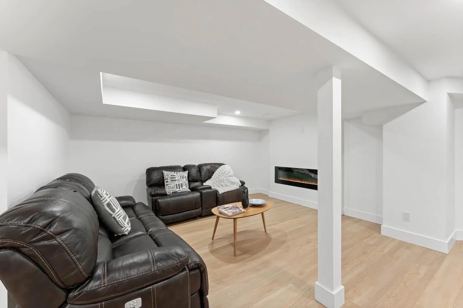 Renovated basement living space showcasing the completed 2,500 sq. ft. basement renovation in OshawaRenovated basement living space showcasing the completed 2,500 sq. ft. basement renovation in Oshawa