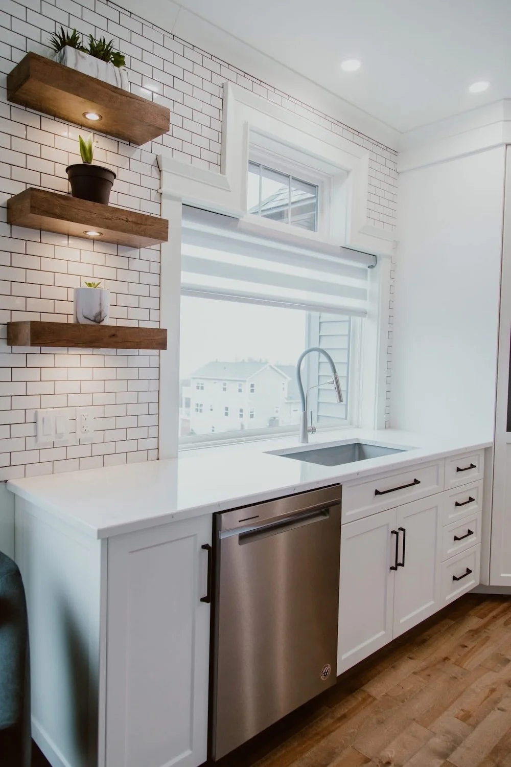 Complete kitchen remodel with open layout, custom cabinets, and quartz surfaces built through a design-build renovation approach.