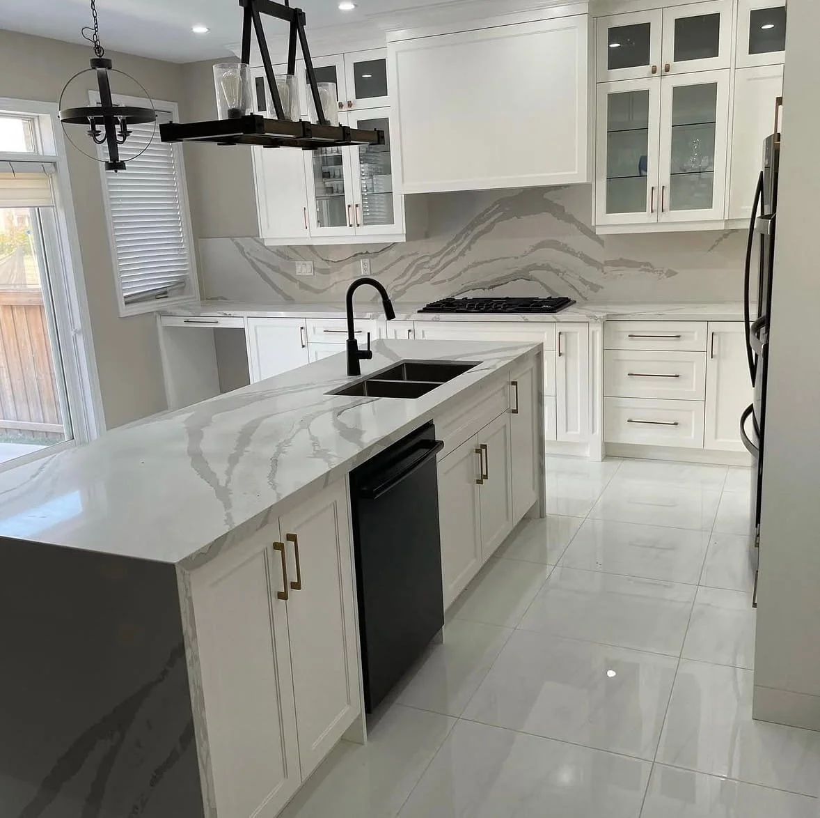 Modern kitchen remodel in Blue Grass Meadows, Whitby, featuring custom cabinetry, quartz countertops, and a bright open layout