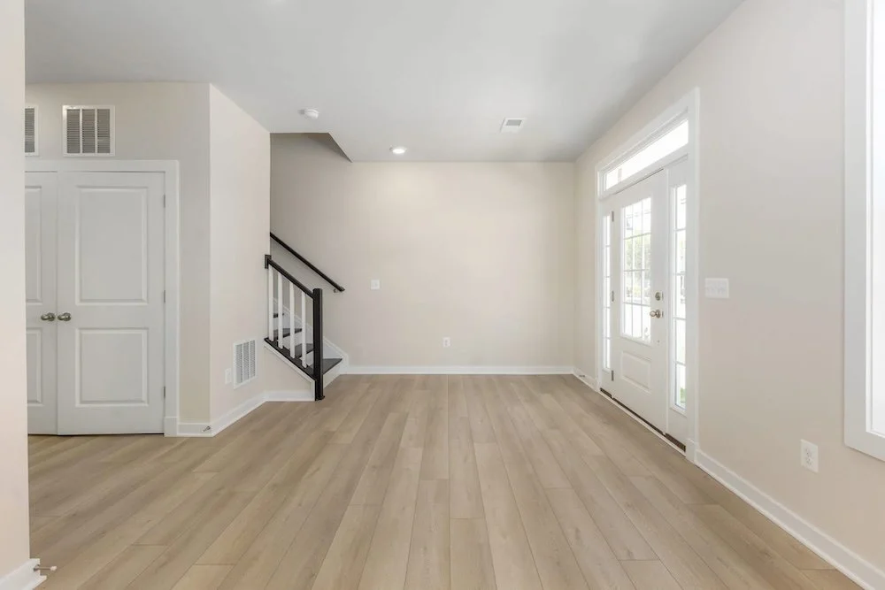 Modern basement renovation in Durham Region with contemporary flooring and lighting